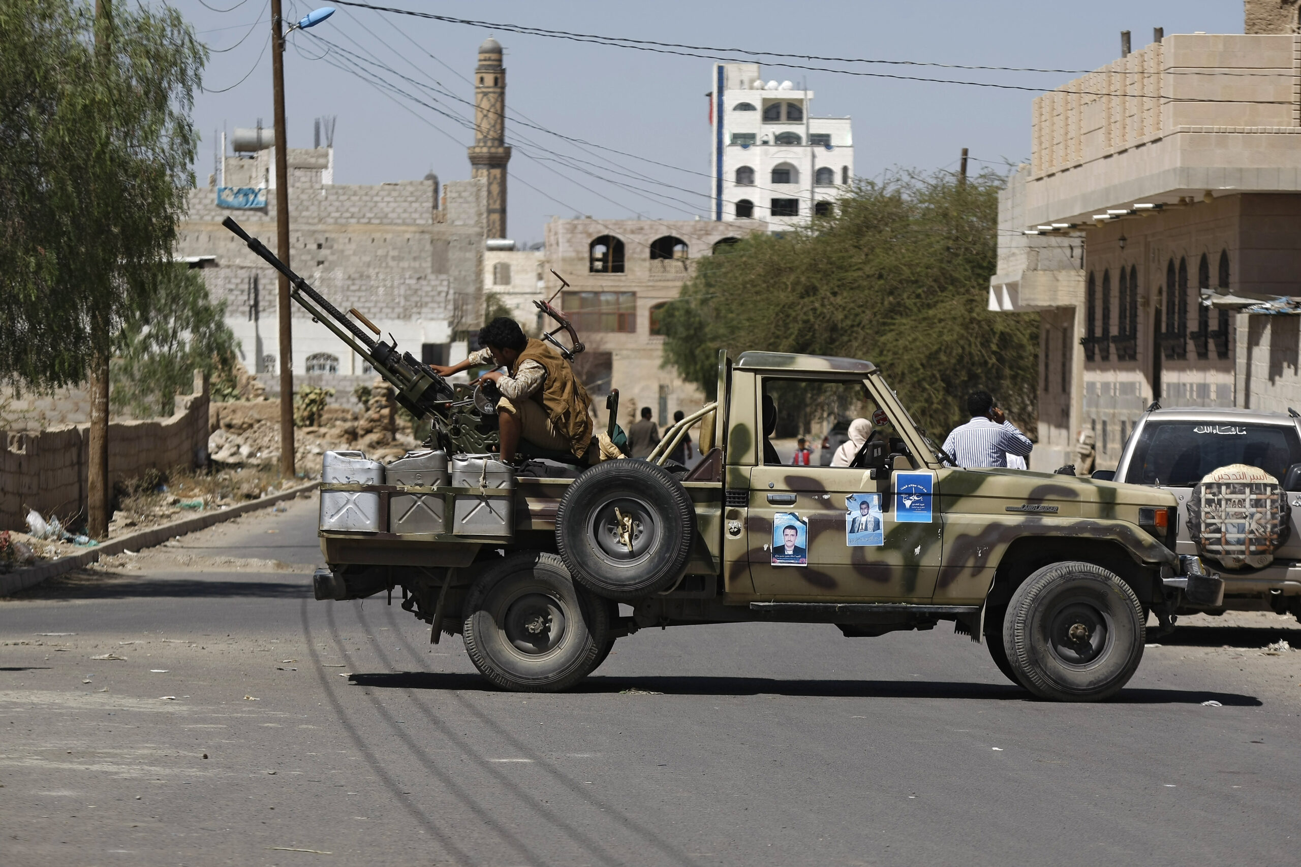 A Houthi rebel mans a machine gun mounted on a military truck in Sanaa, Yemen, Oct. 20, 2014. (AP Photo/Hani Mohammed)