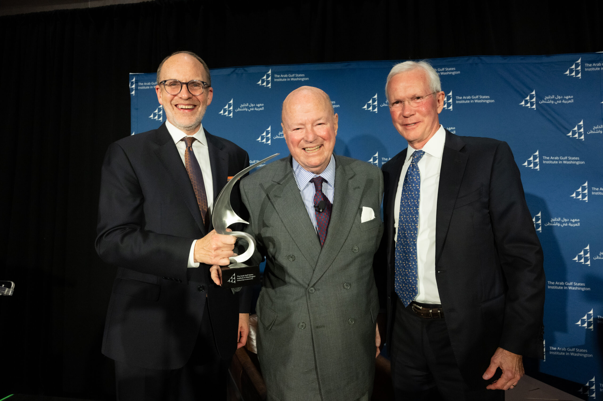 Ambassador Douglas A. Silliman, left, Ambassador Frank G. Wisner, center, and Ambassador C. David Welch, right, pose during the presentation of AGSIW's inaugural Bridgebuilder Award.