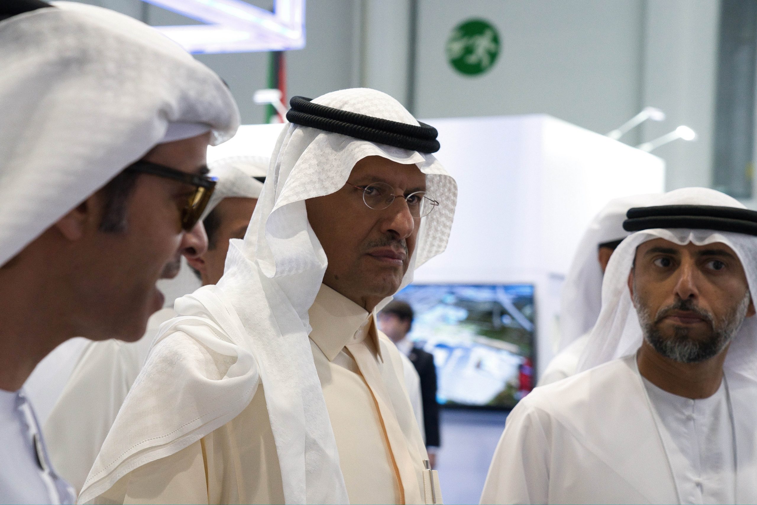 Saudi Minister of Energy Prince Abdulaziz bin Salman, center, and UAE Energy Minister Suhail Mohamed Faraj al-Mazrouei, right, walk through an energy exhibition in Abu Dhabi, United Arab Emirates, Sept. 9, 2019. (AP Photo/Jon Gambrell)