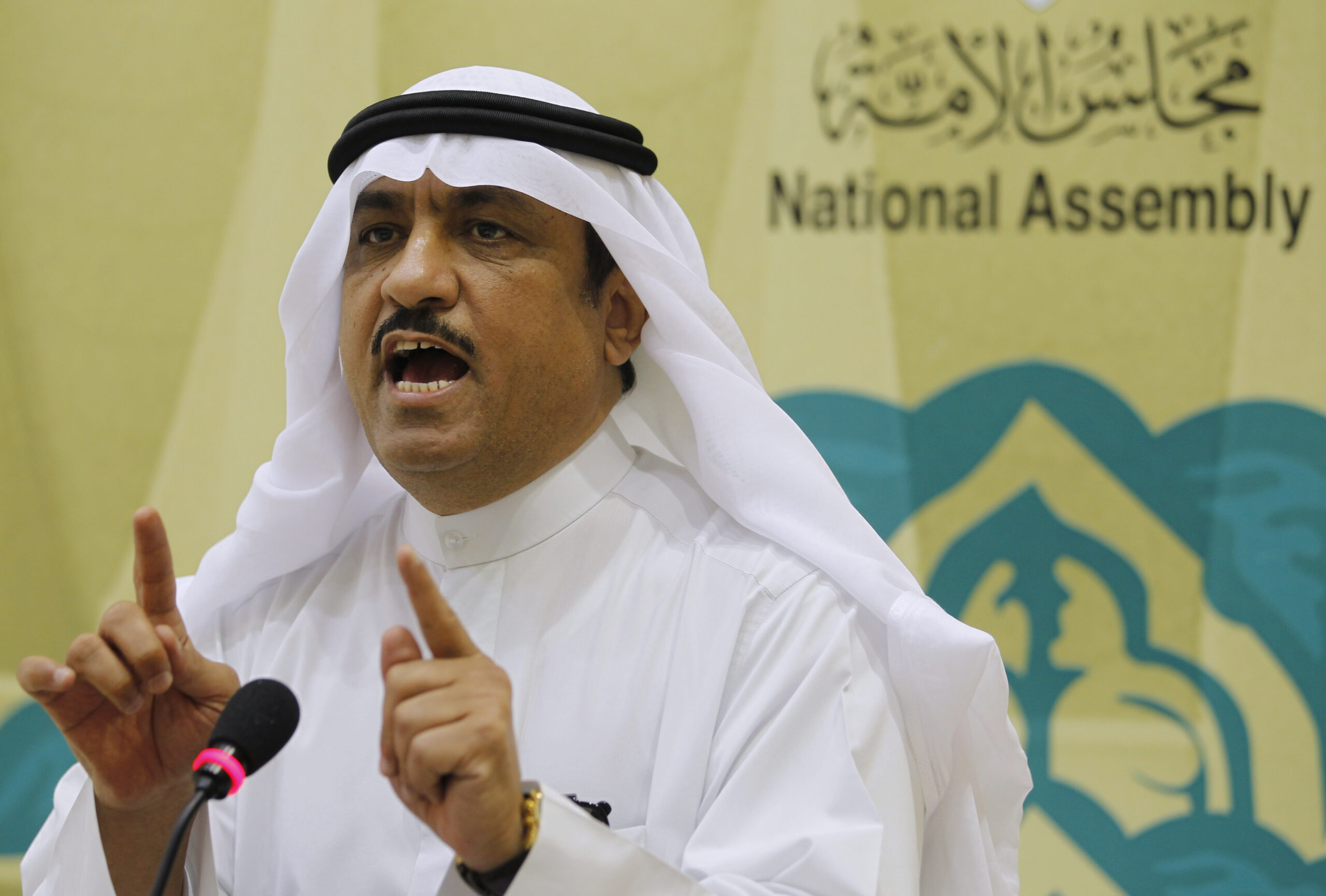 Kuwaiti lawmaker Musallam al-Barrak gestures while speaking to journalists at Parliament's media center in Kuwait City November 20, 2011. (REUTERS/Hamad I Mohammed)