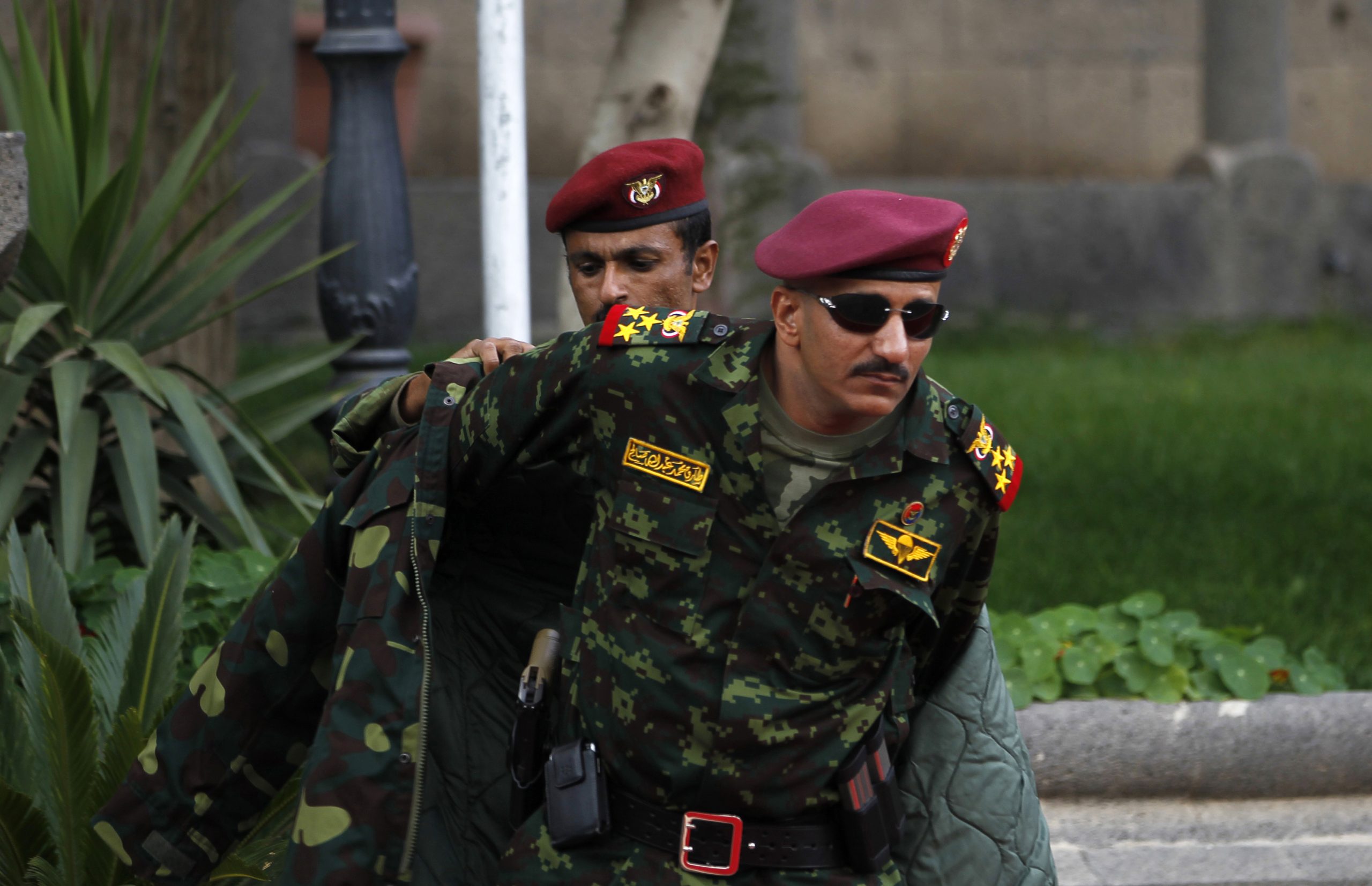 General Tariq Saleh, a nephew of late Yemeni leader Ali Abdullah Saleh, puts on his coat at the Republican Palace in Sanaa, Yemen, January 10, 2011. (REUTERS/Khaled Abdullah)