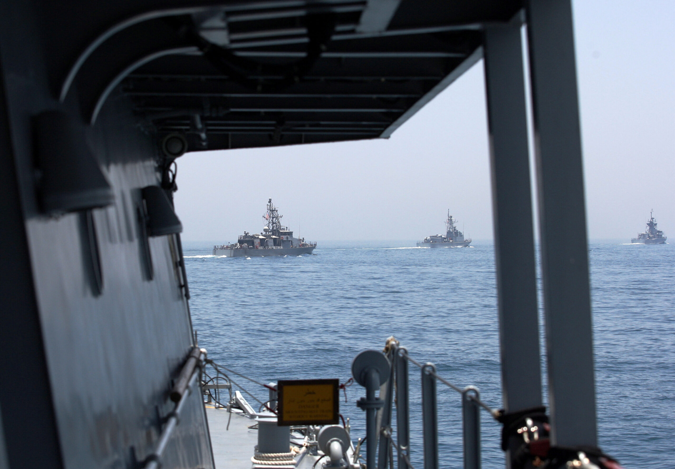 Military ships are seen during a joint naval exercise by U.S. and Qatari troops off the coast of Qatar, June 16, 2017. (REUTERS/Naseem Zeitoon)
