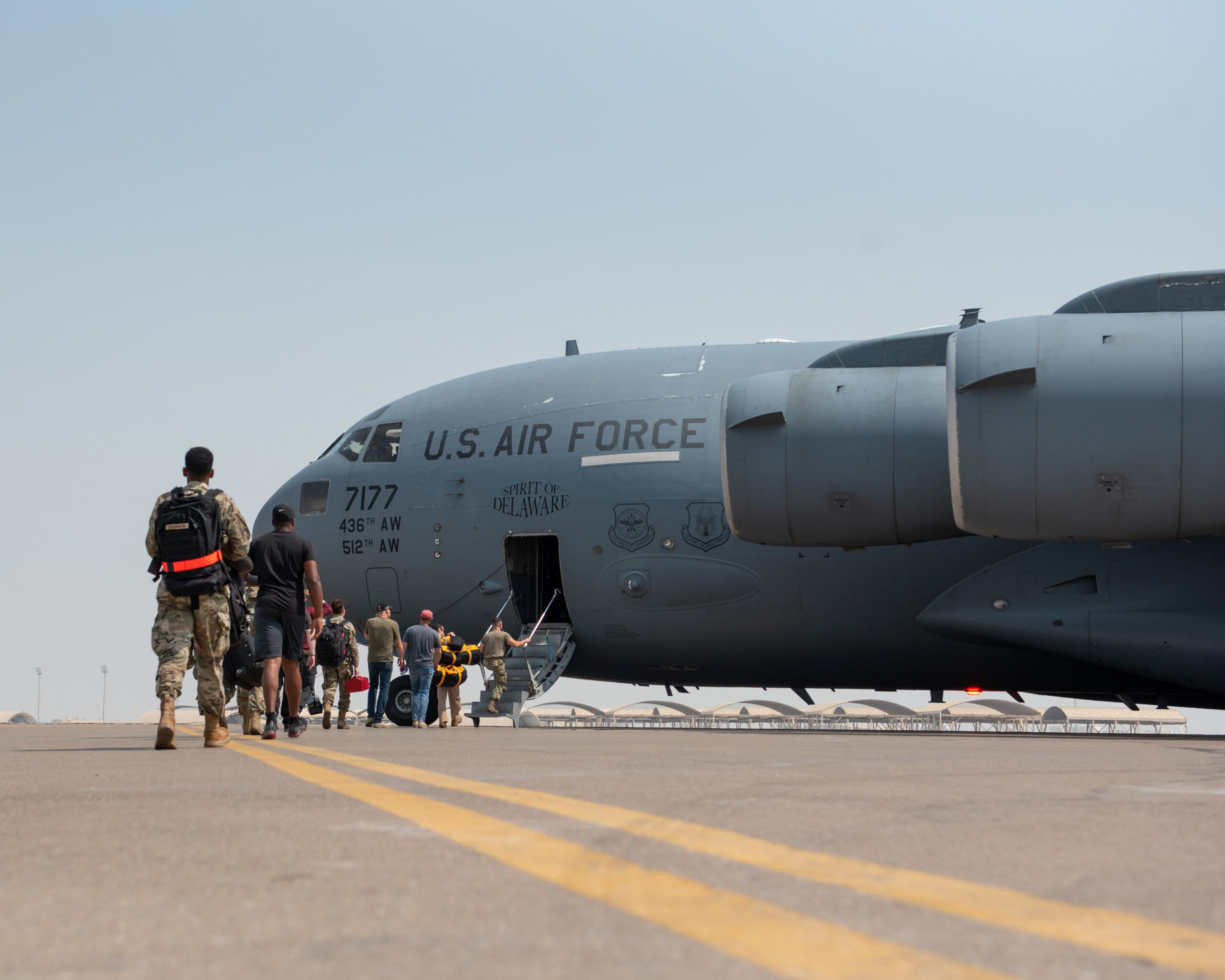 Members of the 4th Expeditionary Fighter Squadron board a C-17 Globemaster III to forward deploy to an undisclosed location in support of exercise Agile Lightning from Al Dhafra Air Base, Abu Dhabi, United Arab Emirates, August 4, 2019. (Chris Thornbury/U.S. Air Force/Handout via REUTERS)