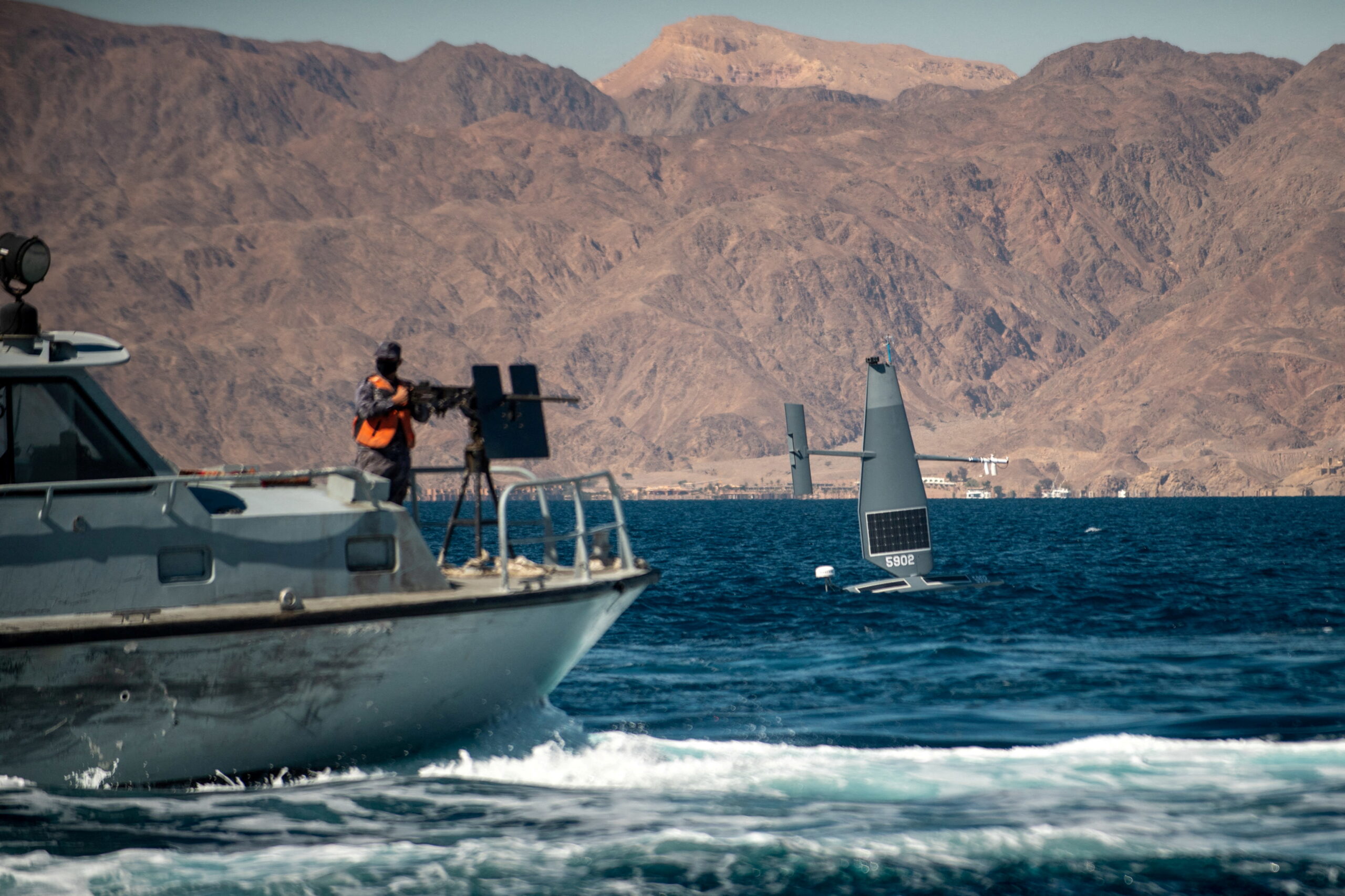 A Saildrone Explorer unmanned surface vessel sails by a Royal Jordanian Navy patrol craft during an International Maritime Exercise in the Gulf of Aqaba, Jordan, February 9. (U.S. Naval Forces Central Command/2nd Class Dawson Roth/Handout via REUTERS ATTENTION)