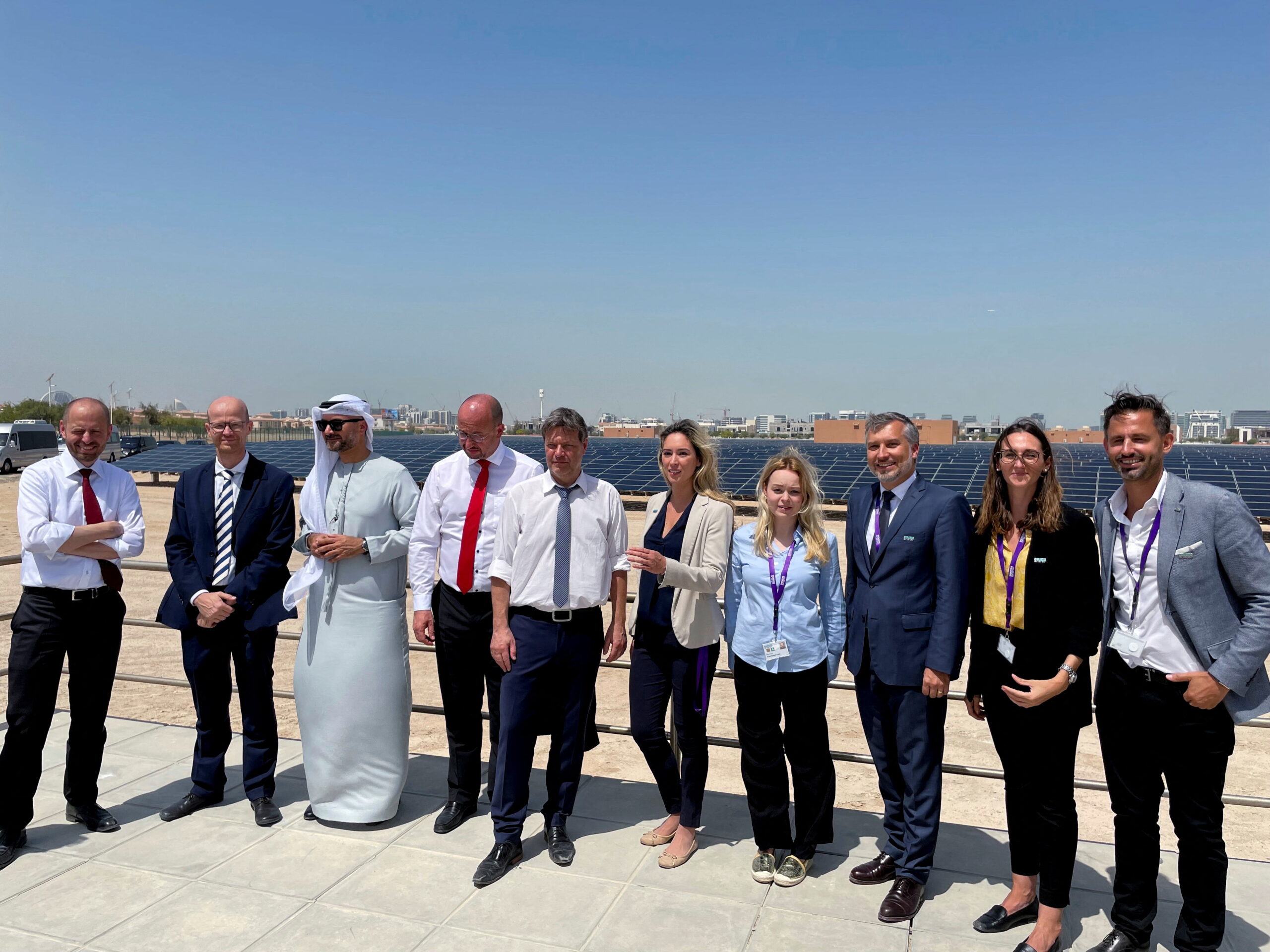 German Economy Minister Robert Habeck, fifth from left, poses during a tour of the solar field in Masdar City, Abu Dhabi, United Arab Emirates, March 21. (REUTERS/Riham Alkousaa)