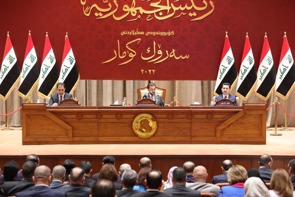 Iraqi lawmakers attend a parliamentary session to vote for a new head of state in Baghdad, Iraq, October 13, 2022. (Iraqi Parliament Media Office/Handout via REUTERS)