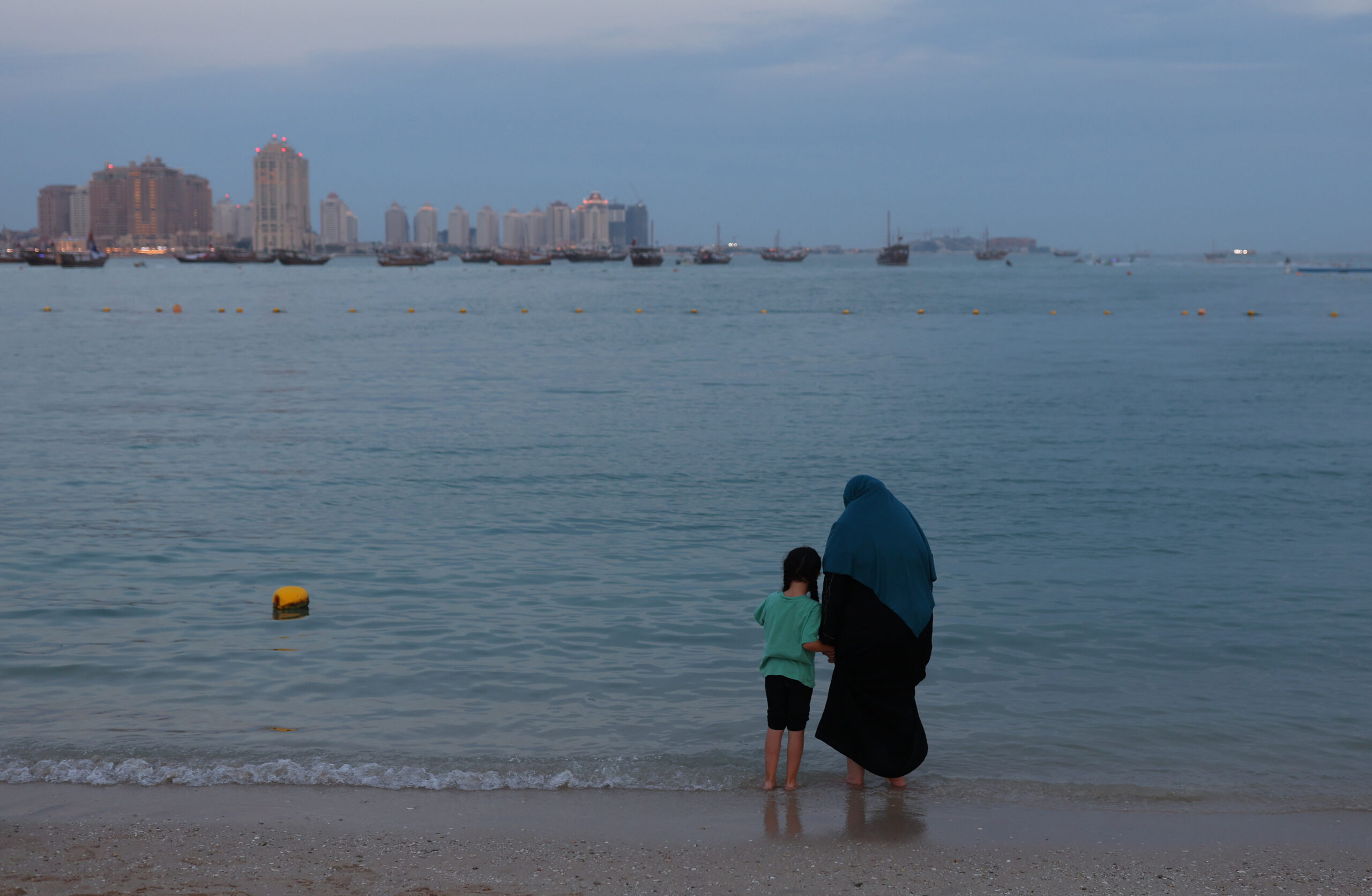 A woman and a child are seen at Katara Beach, Doha, Qatar, November 29, 2022. (REUTERS/Amanda Perobelli)