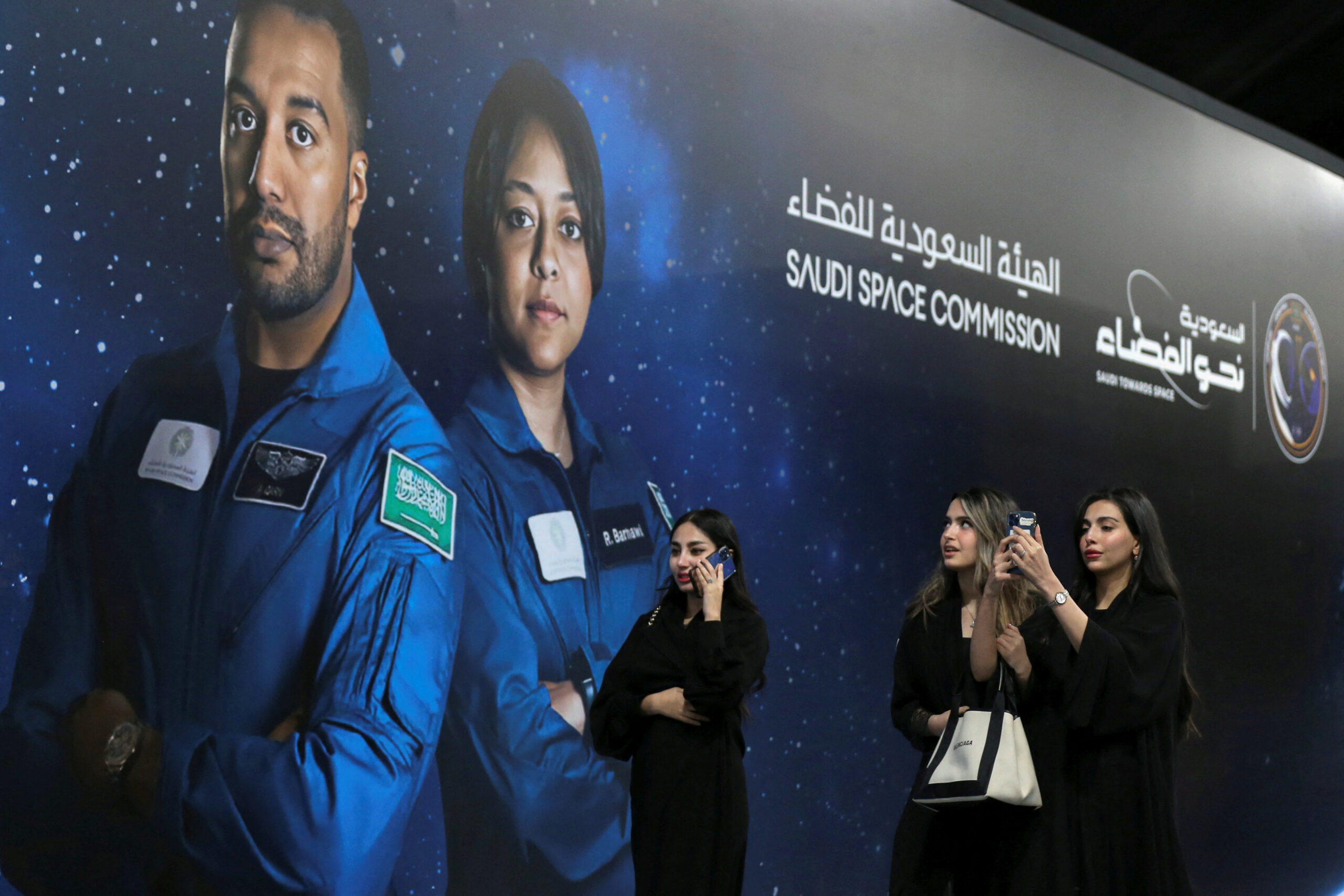 Women in Riyadh, Saudi Arabia arrive to watch the launch of a SpaceX Falcon 9 and Dragon capsule from Kennedy Space Center, Florida, in an event organized to celebrate the first Saudi woman going to space, May 21. (REUTERS/Ahmed Yosri)