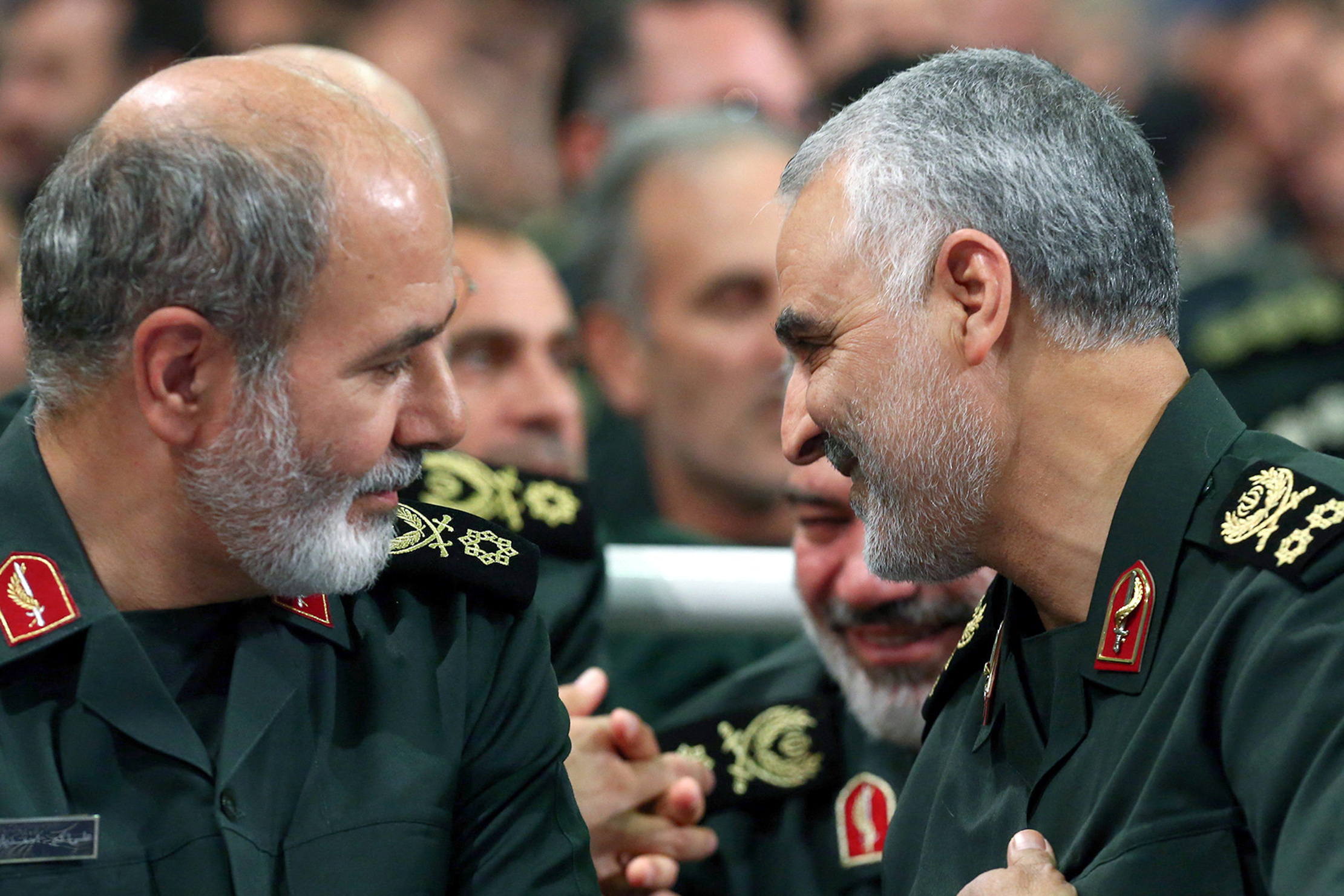 Iran's new secretary of the Supreme National Security Council, Rear Admiral Ali Akbar Ahmadian, is seen next to the late Iranian Major General Qassim Suleimani during a meeting in Tehran, Iran, in this undated picture obtained May 22. (Office of the Iranian Supreme Leader/West Asia News Agency via REUTERS)