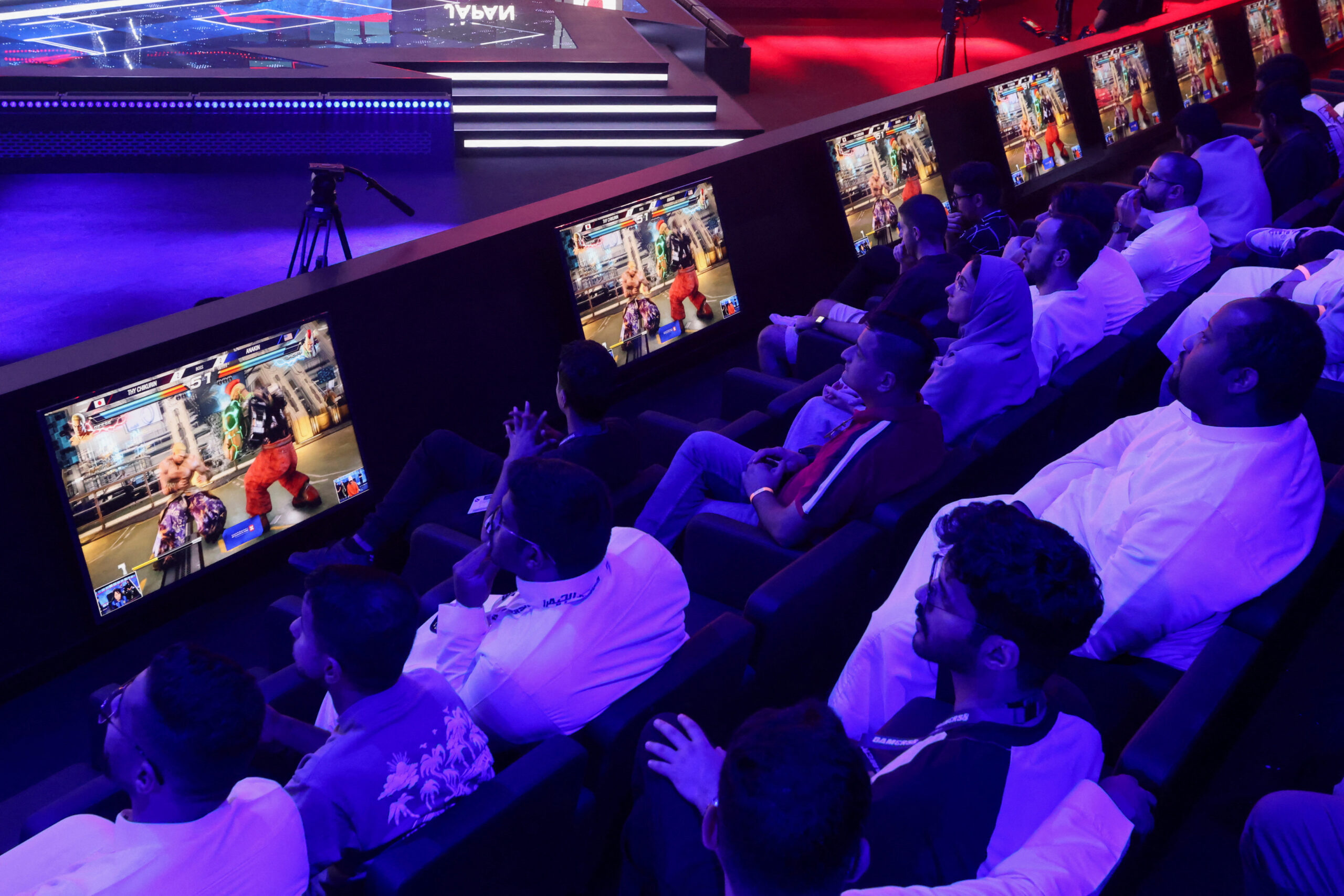 Spectators watch video games as gamers from different countries play during an esports and gaming festival Gamers8 at Boulevard Riyadh, Saudi Arabia, July 9, 2023. (REUTERS/Ahmed Yosri)