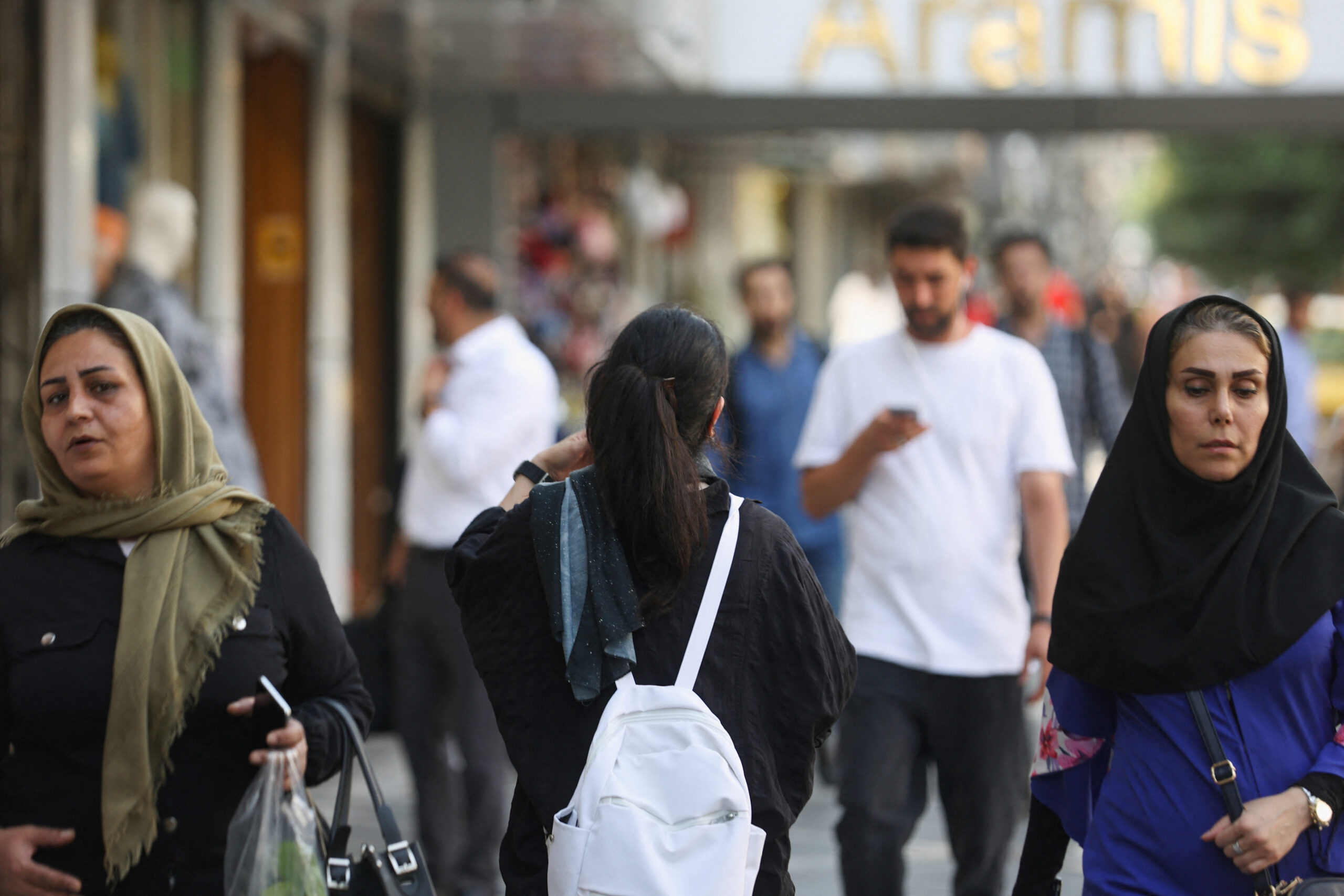 An Iranian woman walks on a street during the revival of the morality police, in Tehran, Iran, July 16, 2023. (Majid Asgaripour/West Asia News Agency via REUTERS)