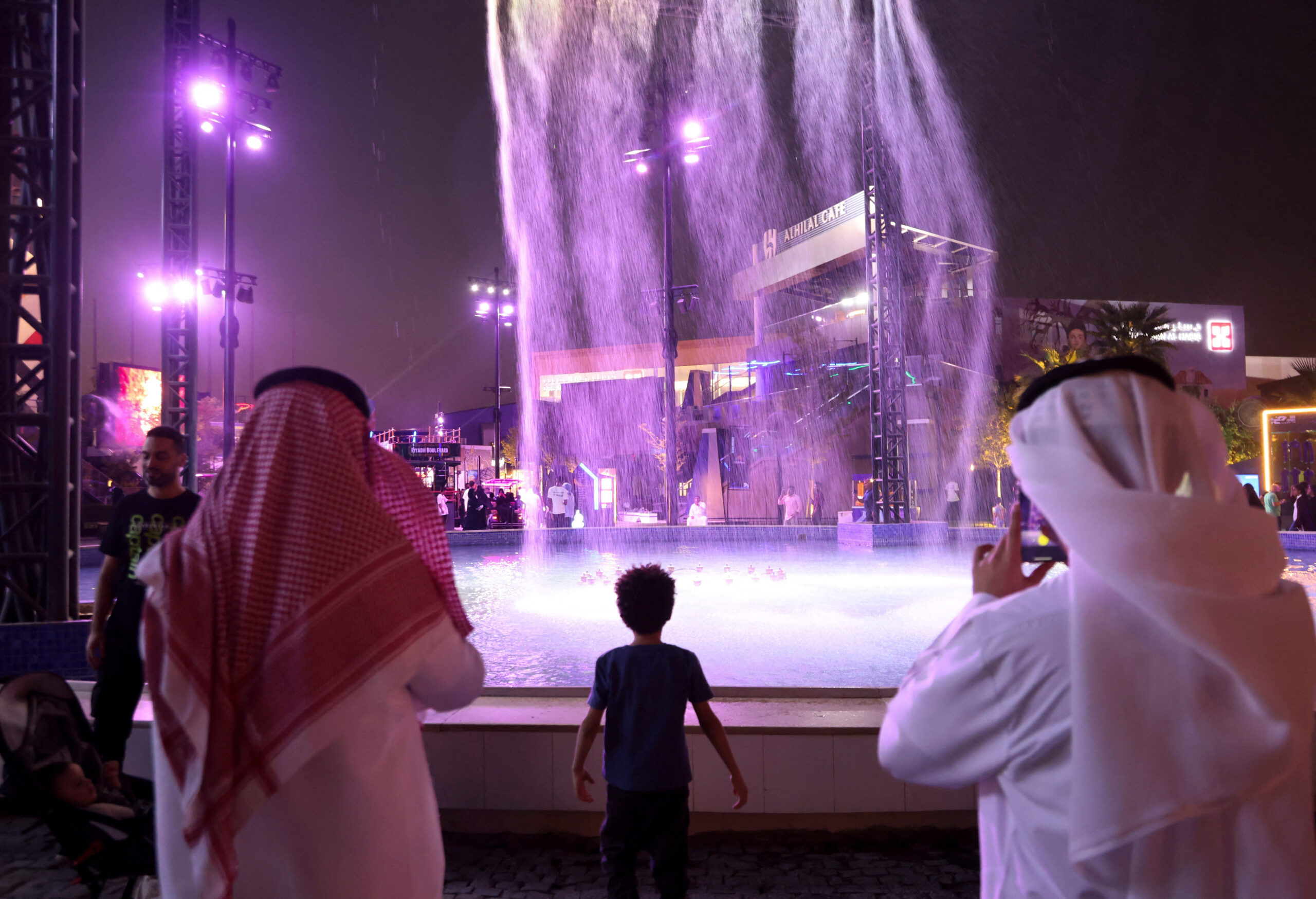 A child plays near a fountain, in Riyadh, Saudi Arabia, August 4. (REUTERS/Ahmed Yosri)
