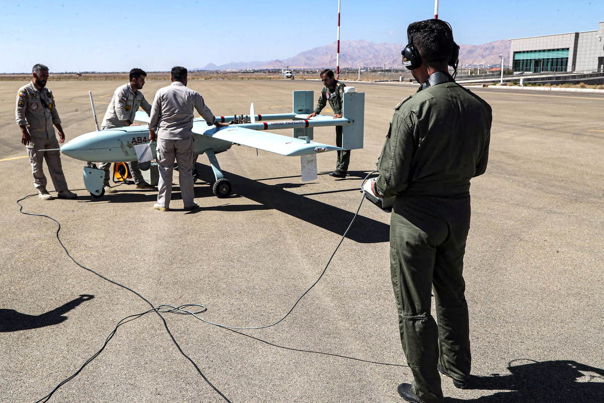 Members of the Iranian army work on a drone during a military exercise in an undisclosed location in Iran, in this handout image obtained on October 4, 2023. (Iranian Army/West Asia News Agency/Handout via REUTERS)