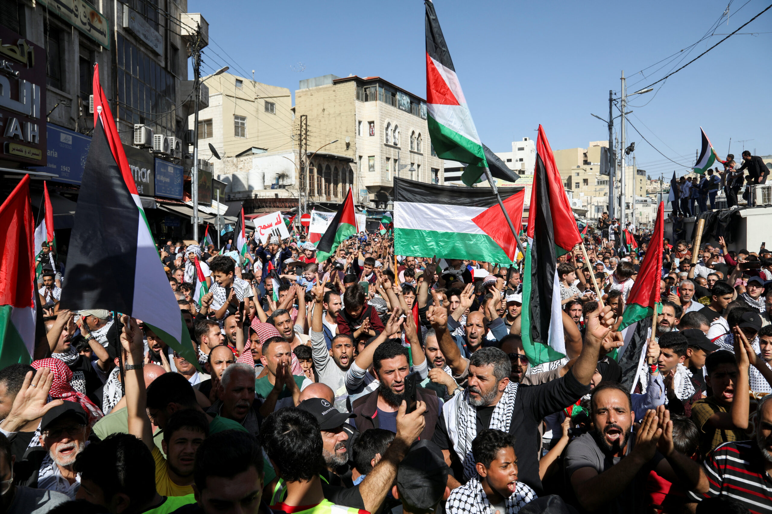 Jordanians carry flags during a protest in support of Palestinians in Gaza, amid the ongoing conflict between Israel and Hamas, in Amman, Jordan, November 3. (REUTERS/Alaa Al Sukhni)