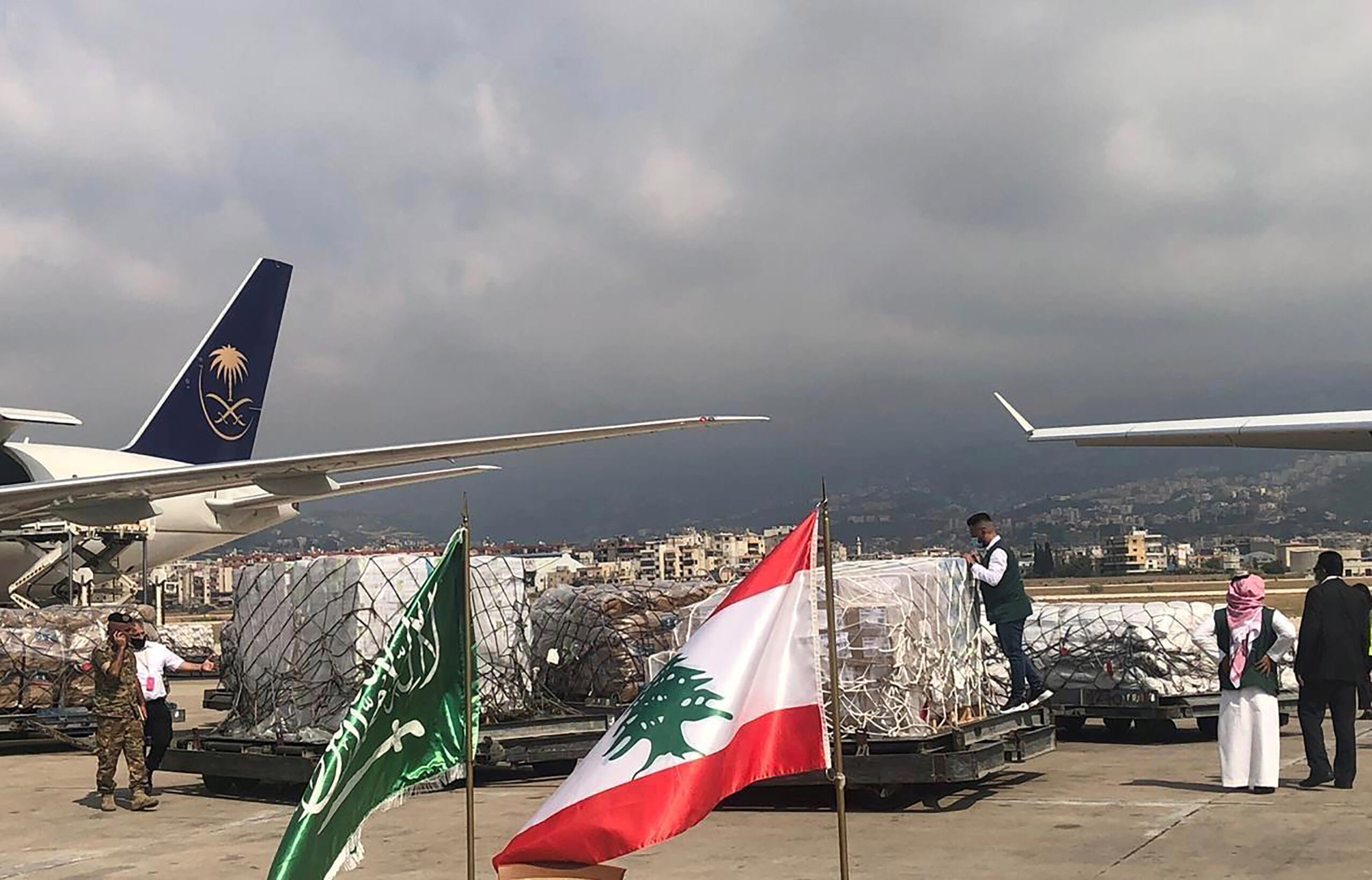 King Salman Humanitarian Aid and Relief Center staff members unload humanitarian aid at Beirut International Airport following the August 4 explosion, August 7, 2020. (Saudi Press Agency/Handout via REUTERS)
