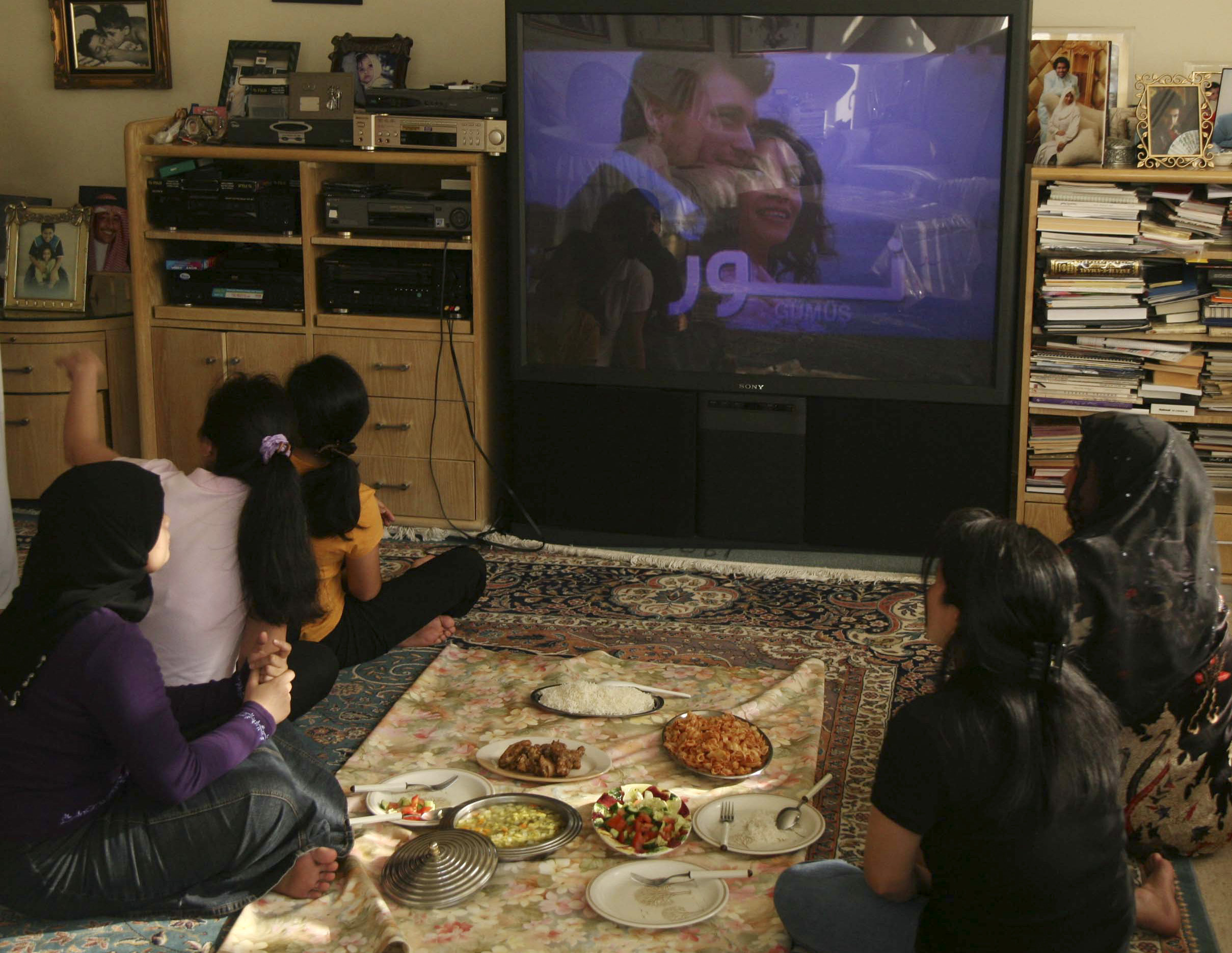 A family watches the Turkish soap opera 'Noor' in Jeddah, Saudi Arabia, July 26, 2008. (REUTERS/Susan Baaghi)