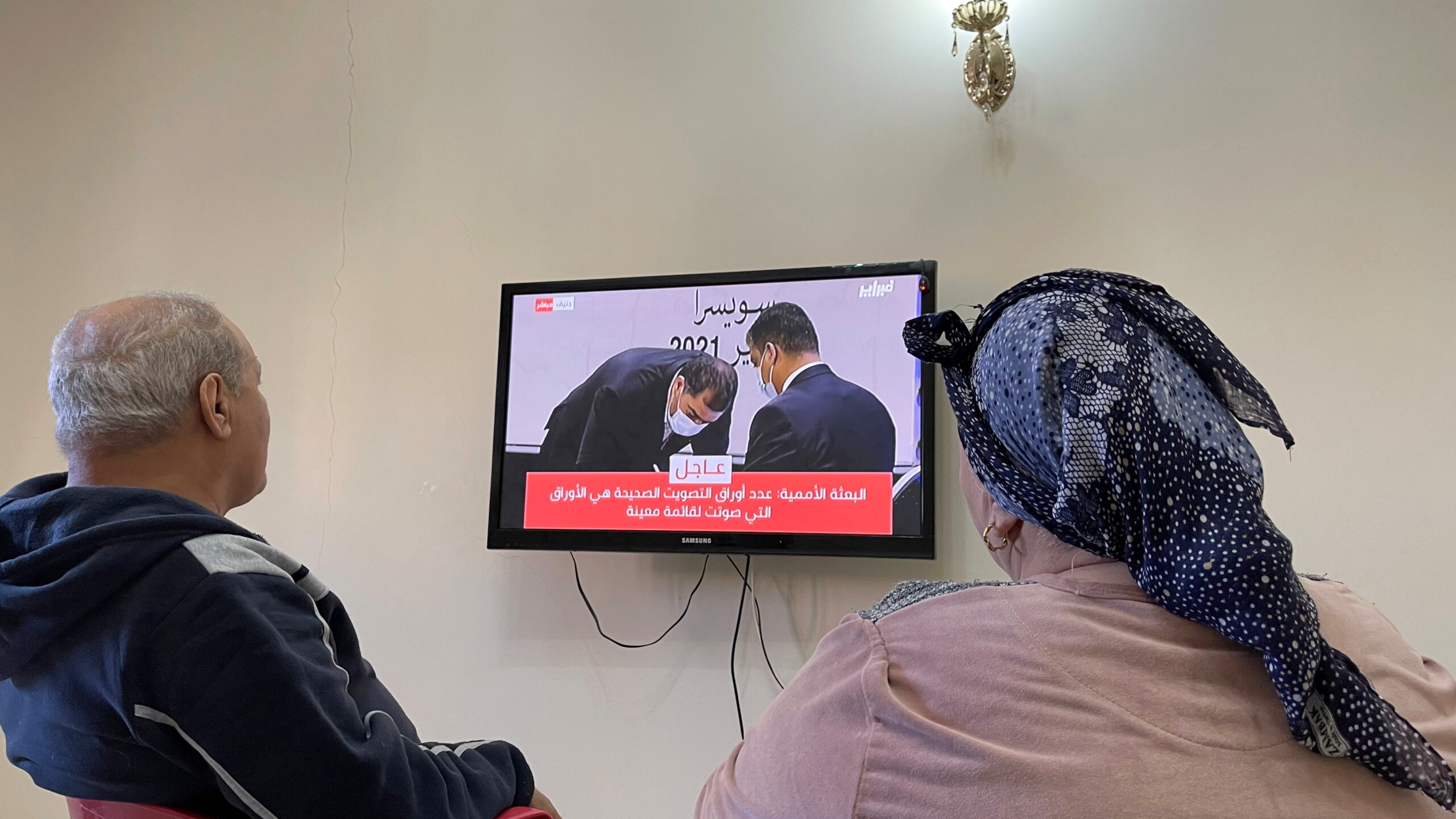 A Libyan family watches the elections to choose the new interim government on a TV screen at home in Tajoura suburb of Tripoli, Libya February 5. (REUTERS/Hazem Ahmed)