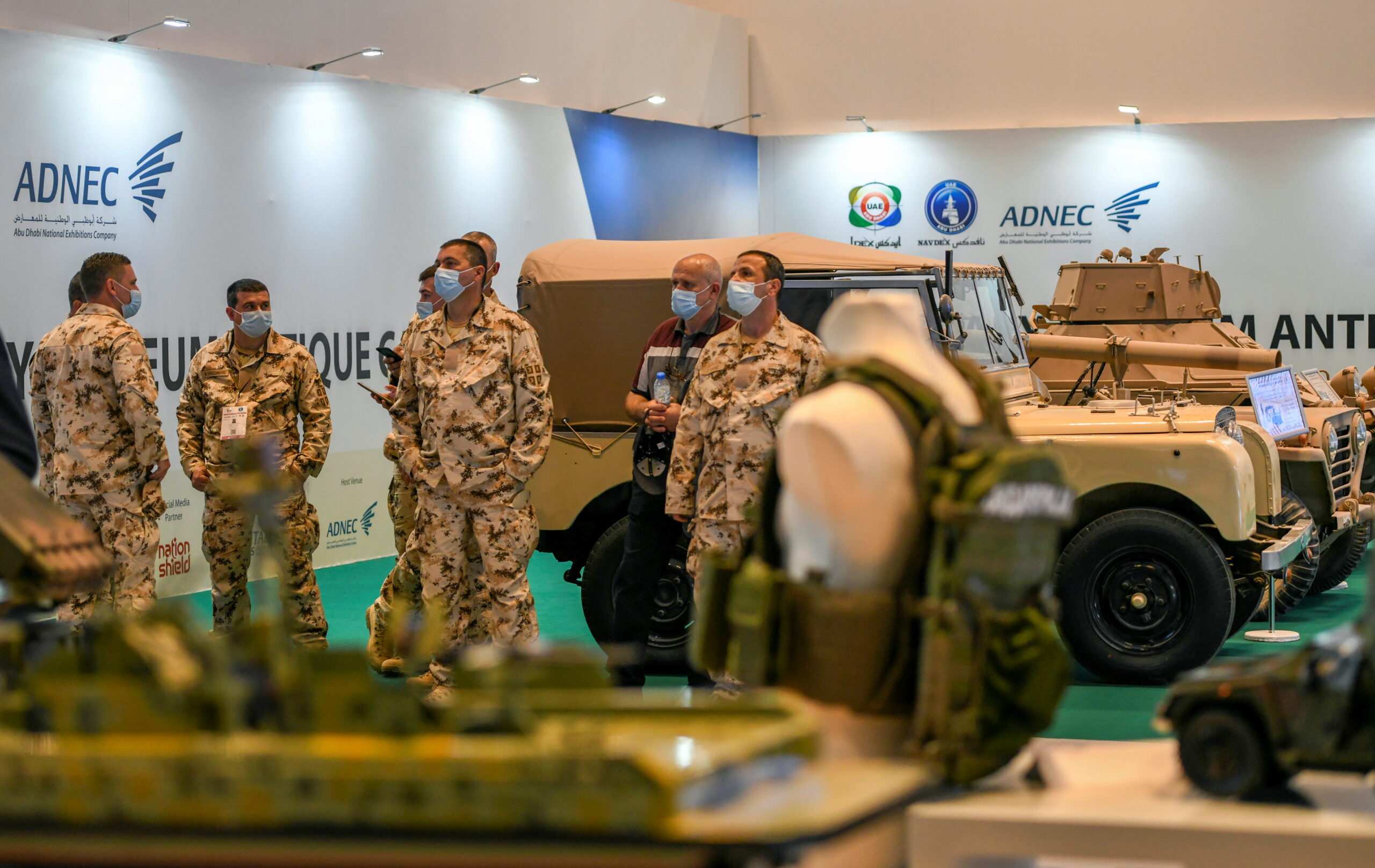 Military officials are seen at the International Defense Exhibition in Abu Dhabi, United Arab Emirates, February 21, 2021. (REUTERS/Khushnum Bhandari)