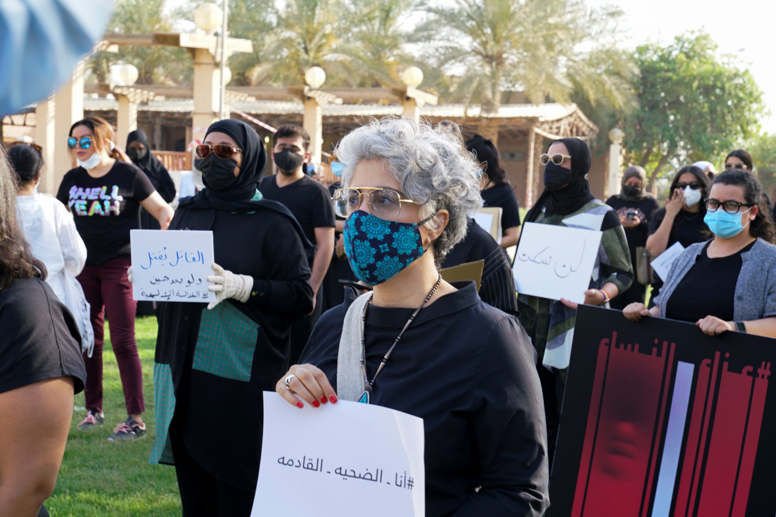 A woman looks on as Kuwaitis gather to protest against violence against women in Kuwait City, Kuwait, April 22. (REUTERS/Stephanie McGehee)