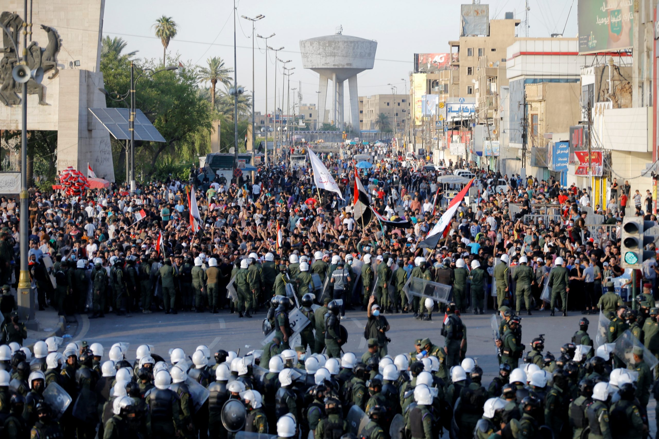 Demonstrators and security forces are seen during an anti-government protest in Baghdad, Iraq, May 25. (REUTERS/Thaier Al-Sudani)
