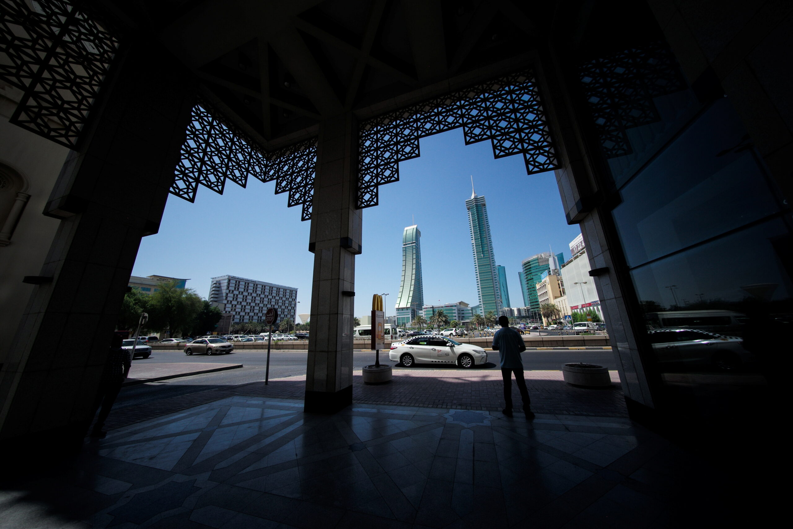 A man waits for a taxi near Bahrain Financial Harbor, Manama, Bahrain, September 23. (REUTERS/Hamad I. Mohammed)