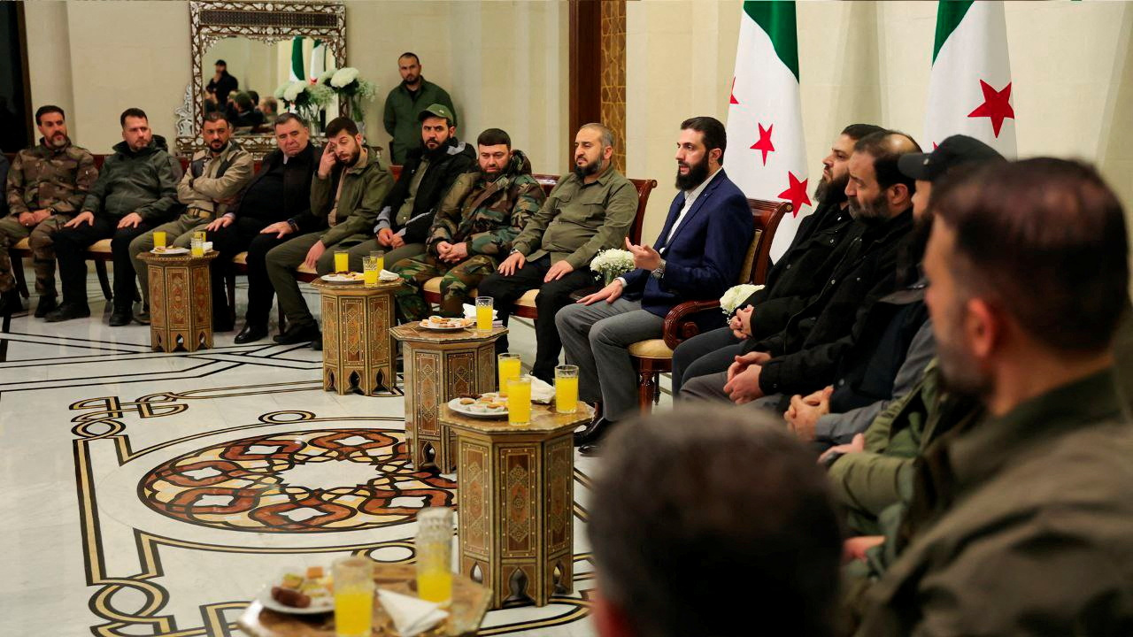 Syria's de facto leader Ahmed Al-Sharaa attends a meeting with former rebel faction chiefs in Damascus, Syria, in this handout image released December 24, 2024. (SANA/Handout via REUTERS)