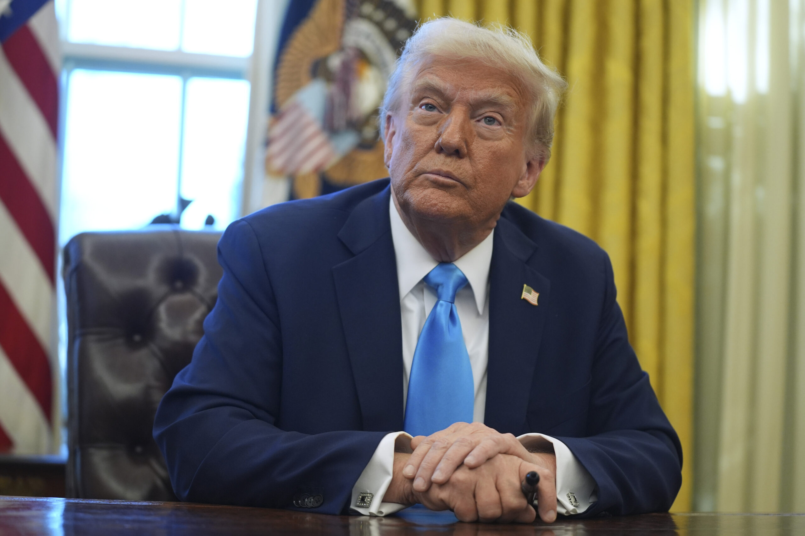 President Donald J. Trump speaks to reporters as he signs executive orders in the Oval Office of the White House, Feb. 4, in Washington, DC. (AP Photo/Evan Vucci)