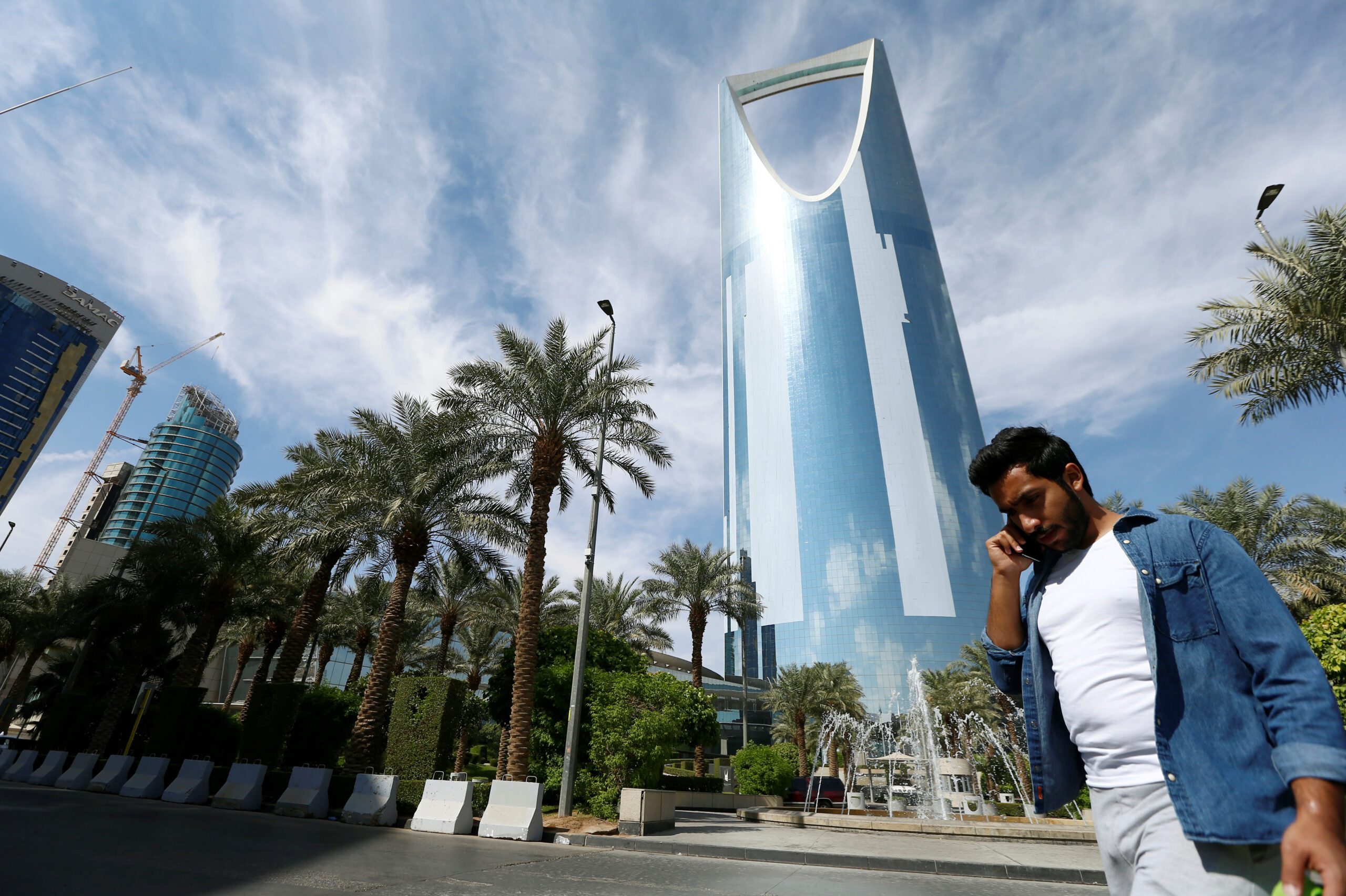 A man speaks on the phone as he walks past the Kingdom Centre Tower in Riyadh, Saudi Arabia, November 5, 2017. (REUTERS/Faisal Al Nasser)