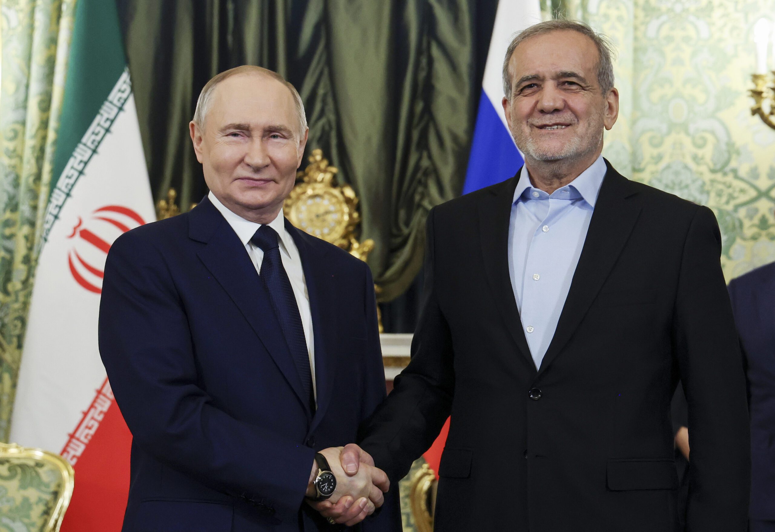 Russian President Vladimir Putin, left, and Iranian President Masoud Pezeshkian pose for a photo during their meeting at the Kremlin in Moscow, Russia, January 17. (Vyacheslav Prokofyev, Sputnik, Kremlin Pool Photo via AP)