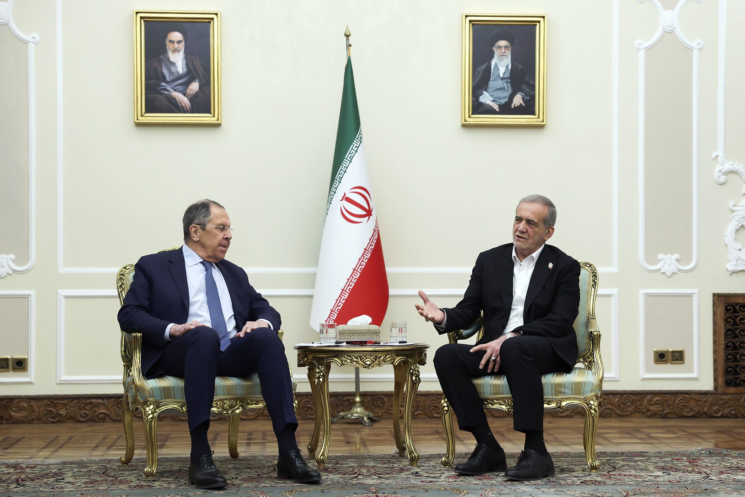 Iranian President Masoud Pezeshkian speaks with Russian Foreign Minister Sergei Lavrov in Tehran, Iran, February 25. (Iranian Presidency Office via AP)