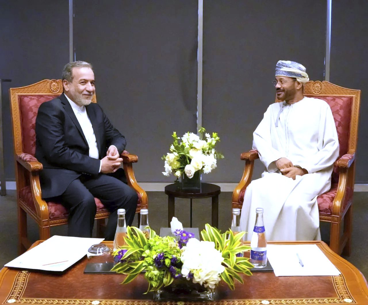 Iranian Foreign Minister Abbas Araghchi, left, meets his Omani counterpart Sayyid Badr Al Busaidi prior to negotiations with Special Envoy to the Middle East Steve Witkoff in Muscat, Oman, Saturday, April 12. (Iranian Foreign Ministry via AP)