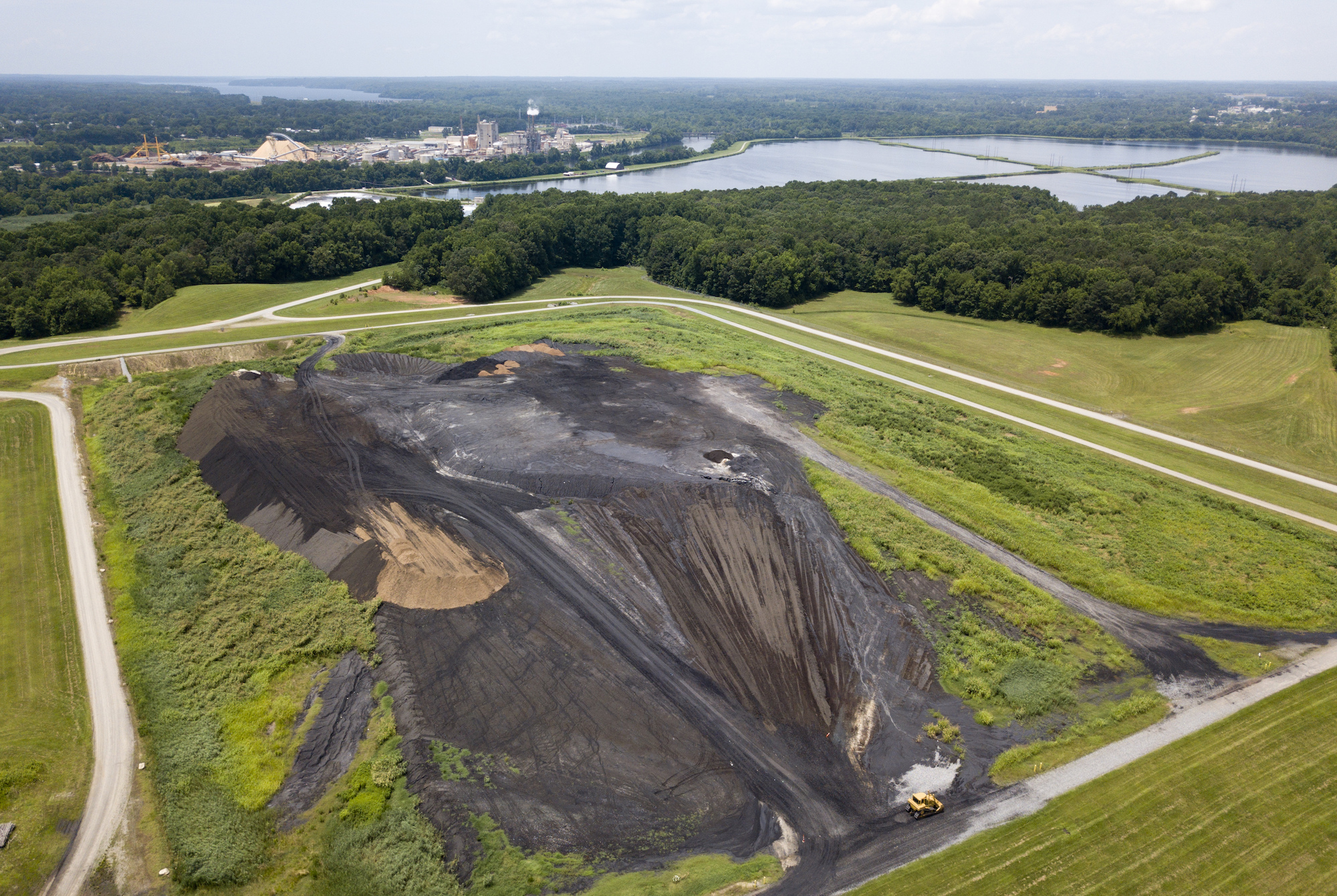 An aerial view of a coal ash site near the KapStone Paper and Packing Corp. plant along the Roanoke River in Roanoke Rapids, N.C. (AP Photo/Steve Helber)