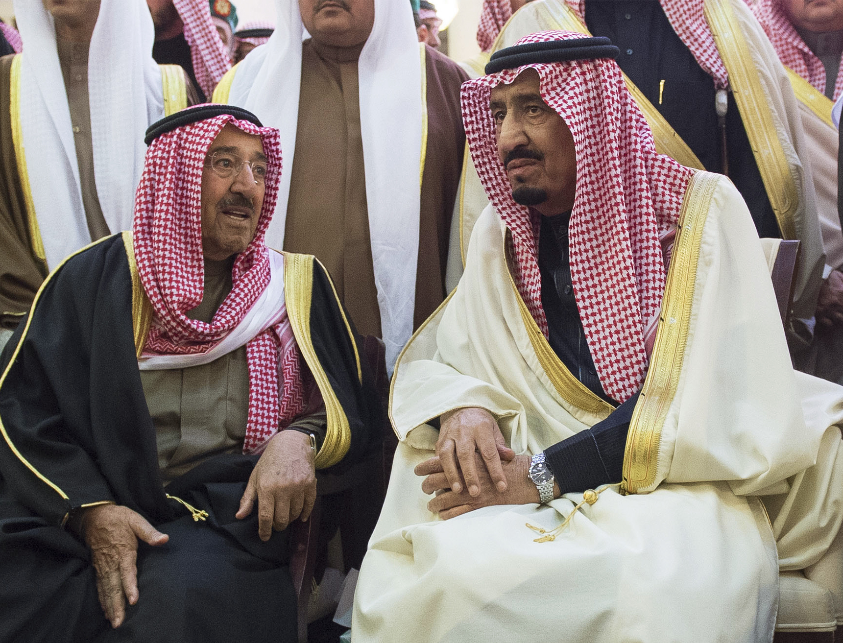 Saudi Arabia's King Salman, right, talks with Kuwait's Emir Sabah al-Ahmed al-Sabah during the funeral of Salman's brother King Abdullah in Riyadh, Saudi Arabia, Jan. 23, 2015. (AP Photo/SPA)