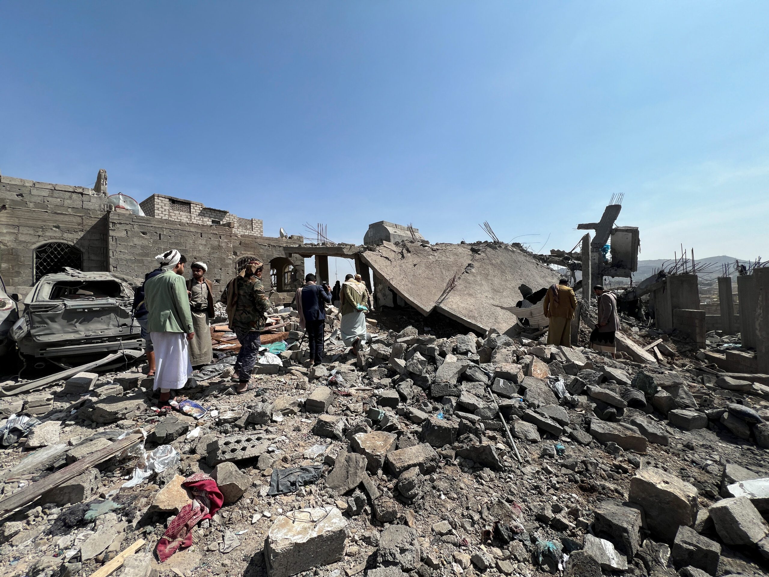 People inspect the site of a U.S. airstrike in Sanaa, Yemen, April 7. (REUTERS/Adel Al Khader)