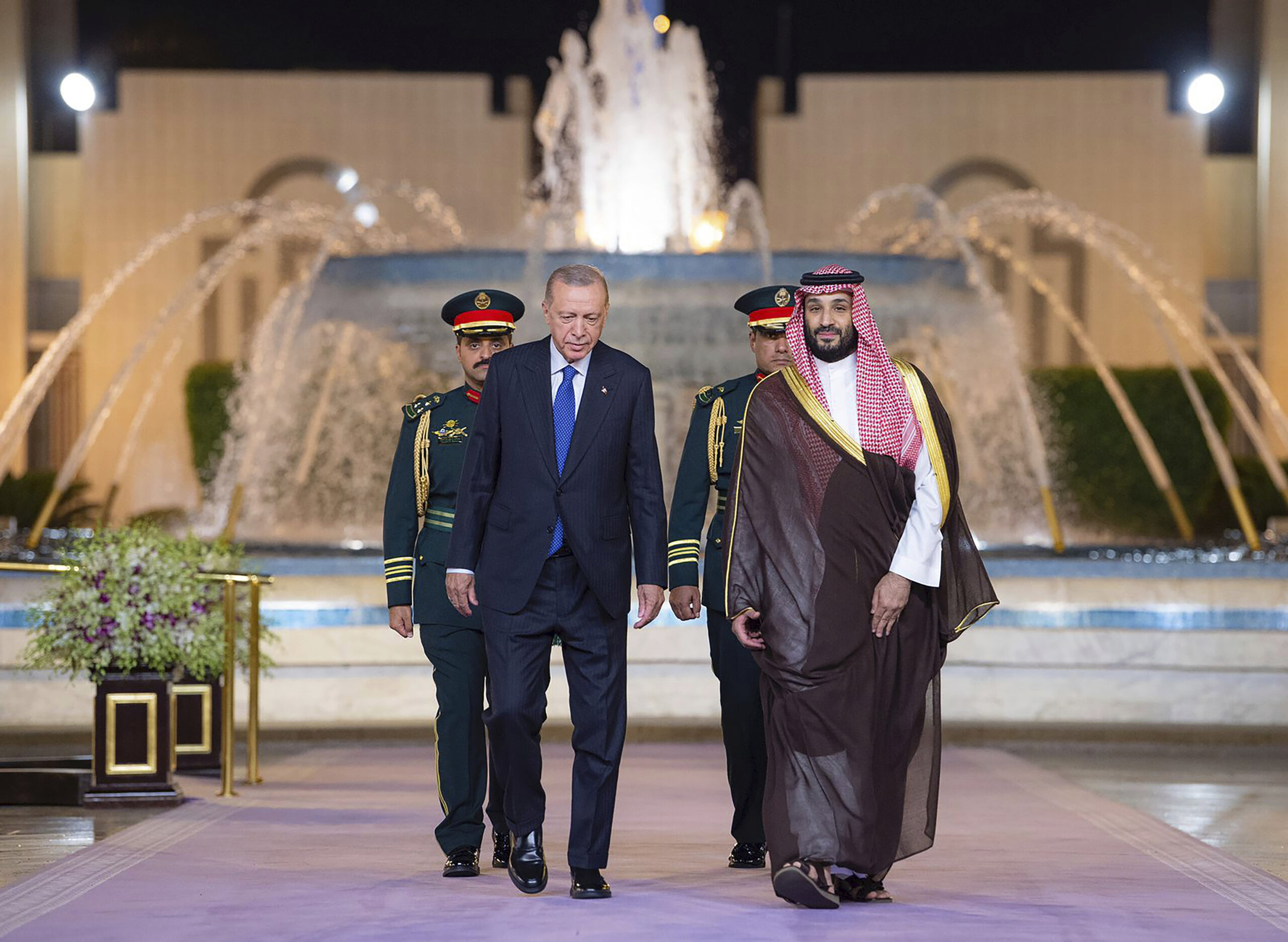 Turkish President Recep Tayyip Erdogan and Saudi Crown Prince Mohammed bin Salman walk during a welcome ceremony at Al Salam Palace in Jeddah, Saudi Arabia, July 17, 2023.(Saudi Press Agency via AP)