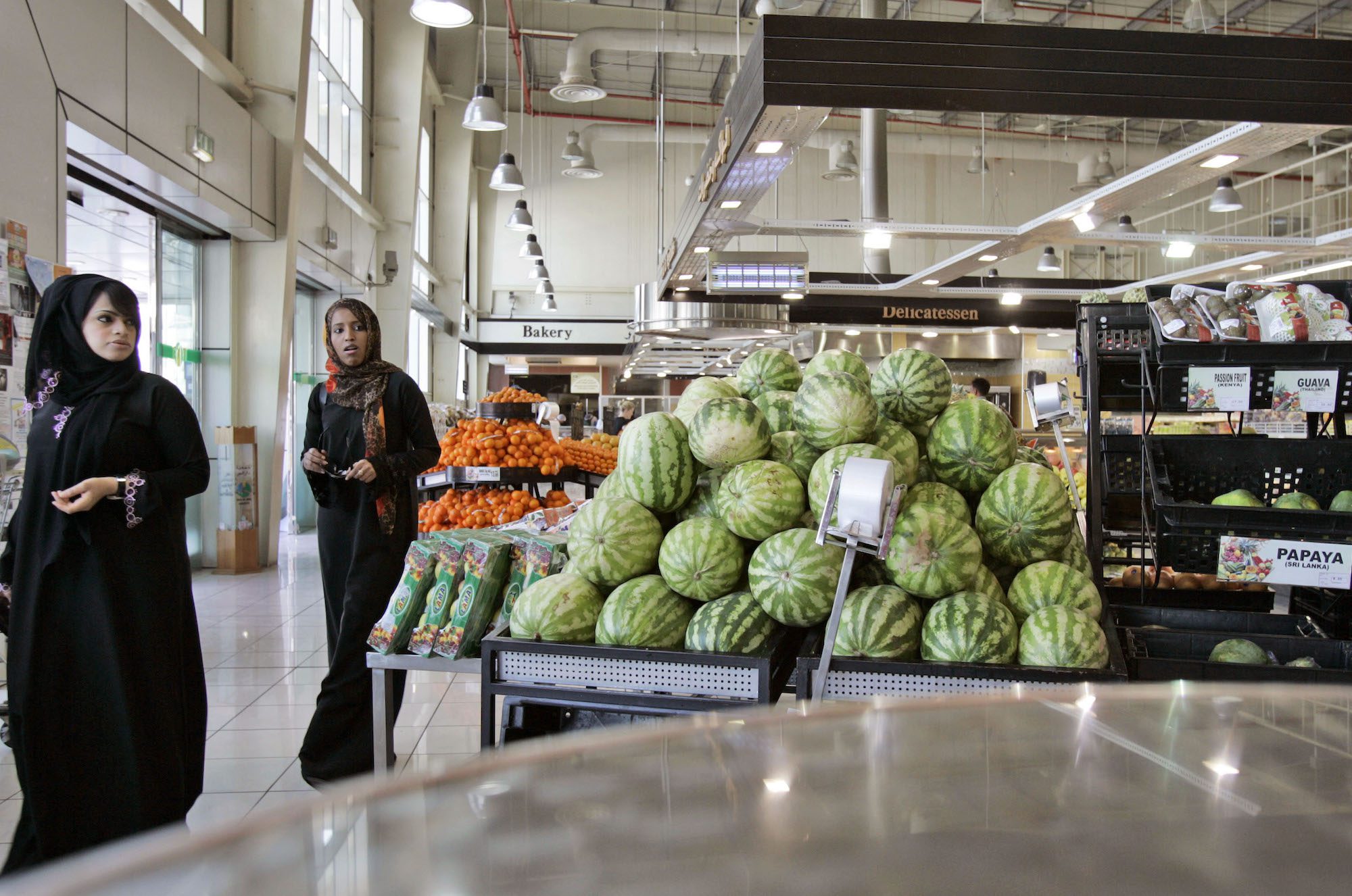 Two women arrive at a supermarket in Dubai, United Arab Emirates. (AP Photo/Kamran Jebreili)