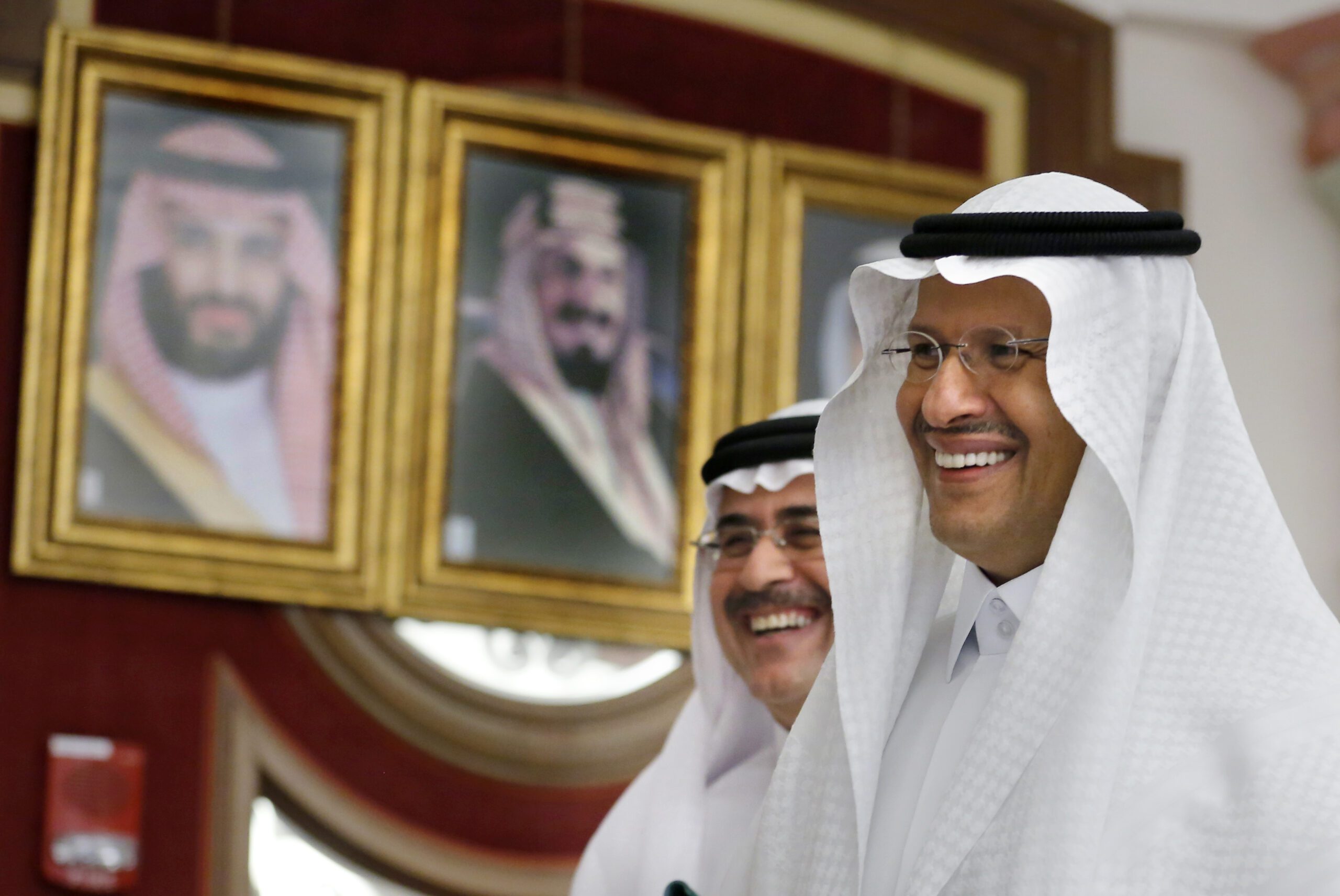 Saudi Minister of Energy Prince Abdulaziz bin Salman, right, and Saudi Aramco President and CEO Amin Nasser smile as they leave a press conference in Jeddah, Saudi Arabia, Tuesday, Sept. 17, 2019. (AP Photo/Amr Nabil)