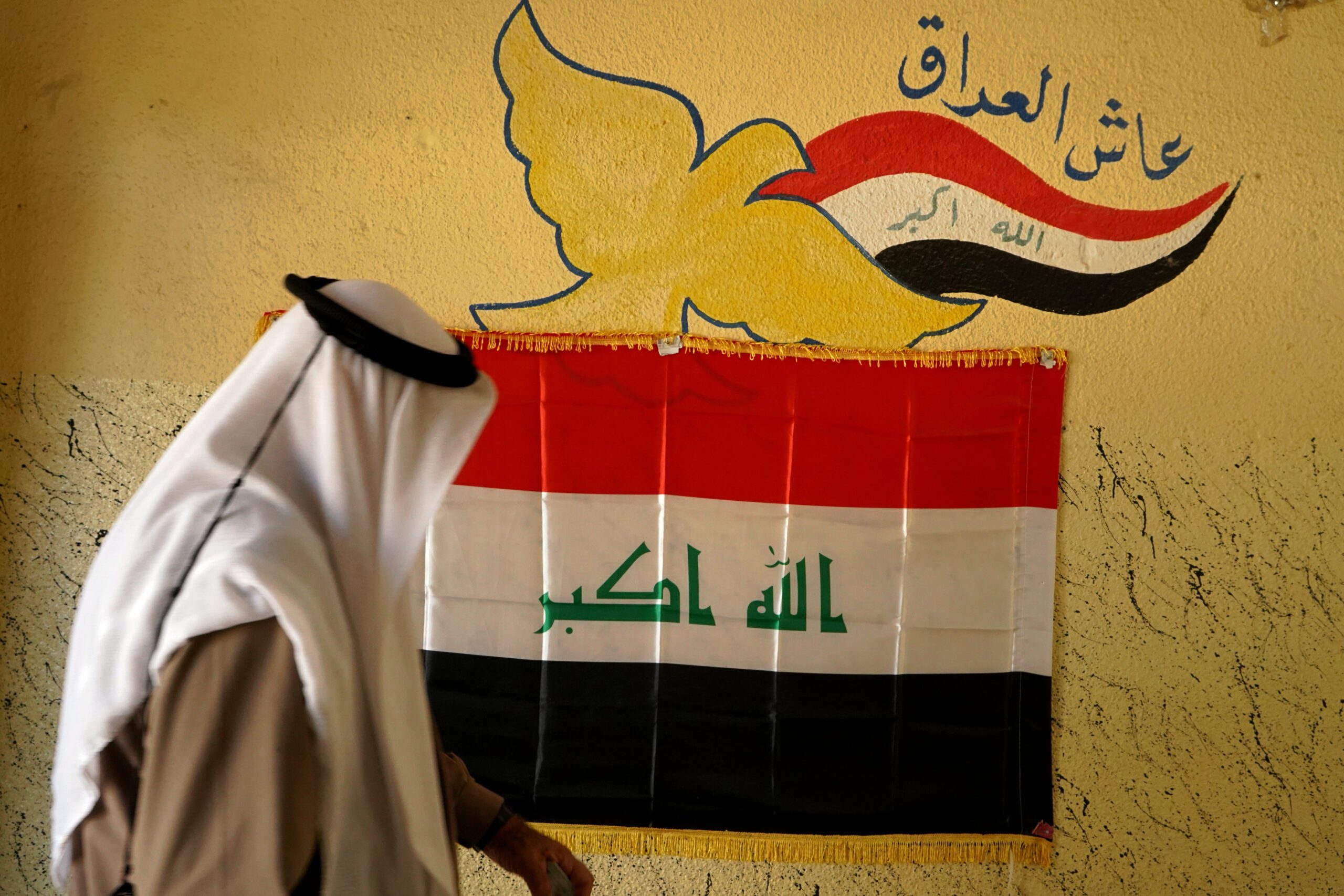 A man arrives at a polling station to vote during parliamentary elections, Mosul, Iraq, Oct. 10. (AP Photo)