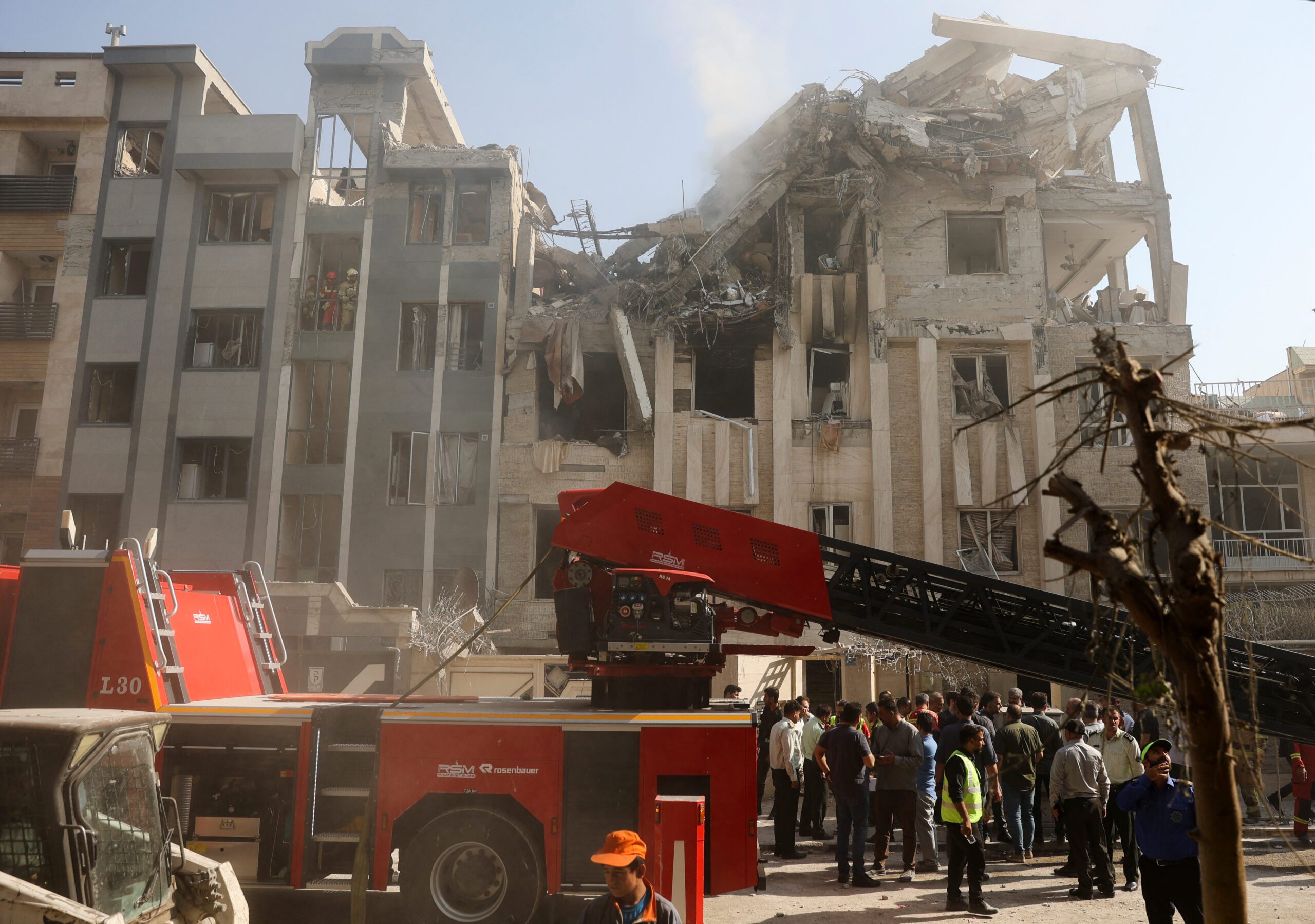 Rescuers work at the scene of a damaged building in the aftermath of Israeli strikes, in Tehran, Iran, June 13. (Majid Asgaripour/WANA via REUTERS)