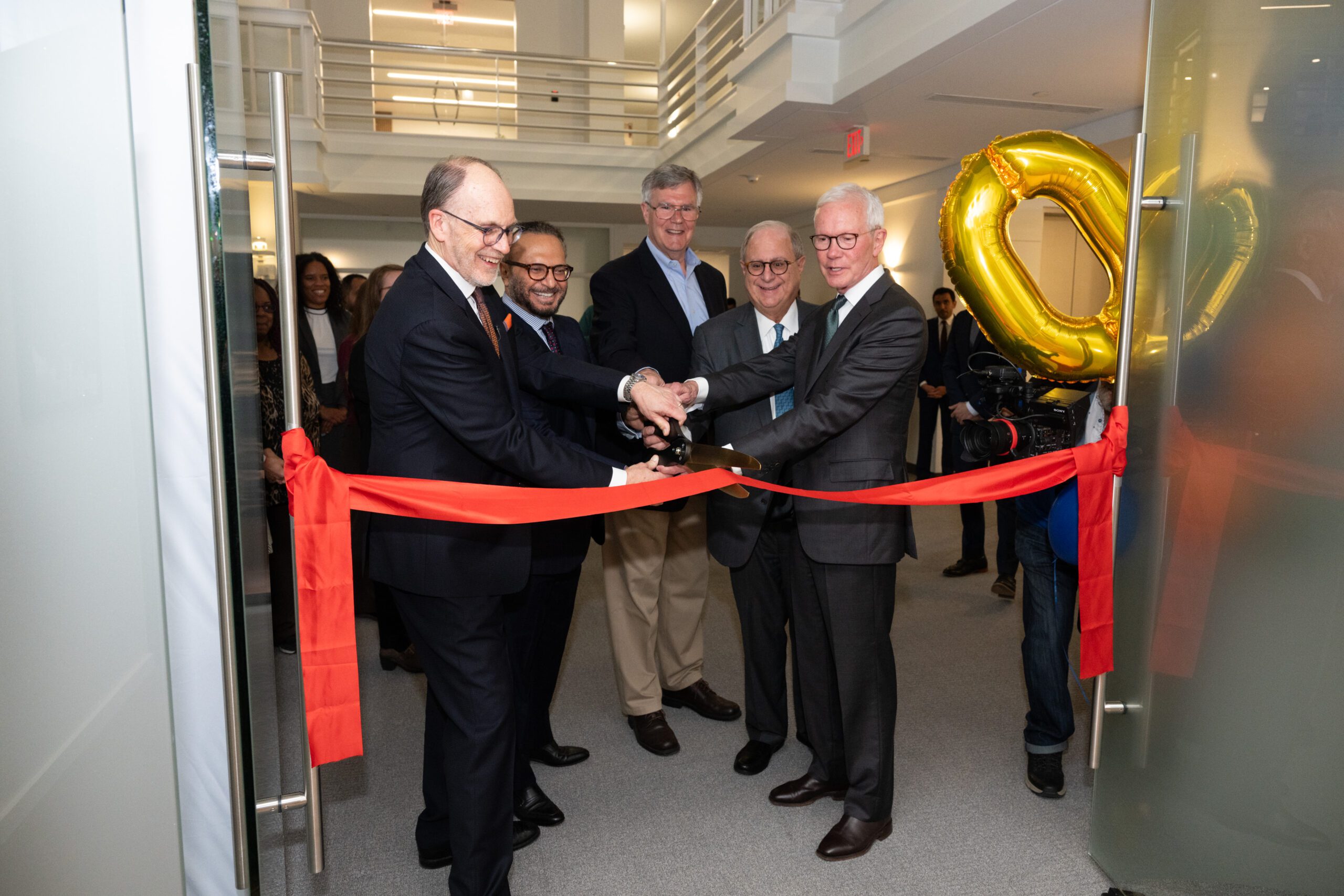 Ambassador Douglas A. Silliman, H.E. Dr. Anwar Gargash, F. Gregory Gause, III, George Salem, and Ambassador C. David Welch cut the ribbon at AGSI's new office. (Credit: Kaveh Sardari)