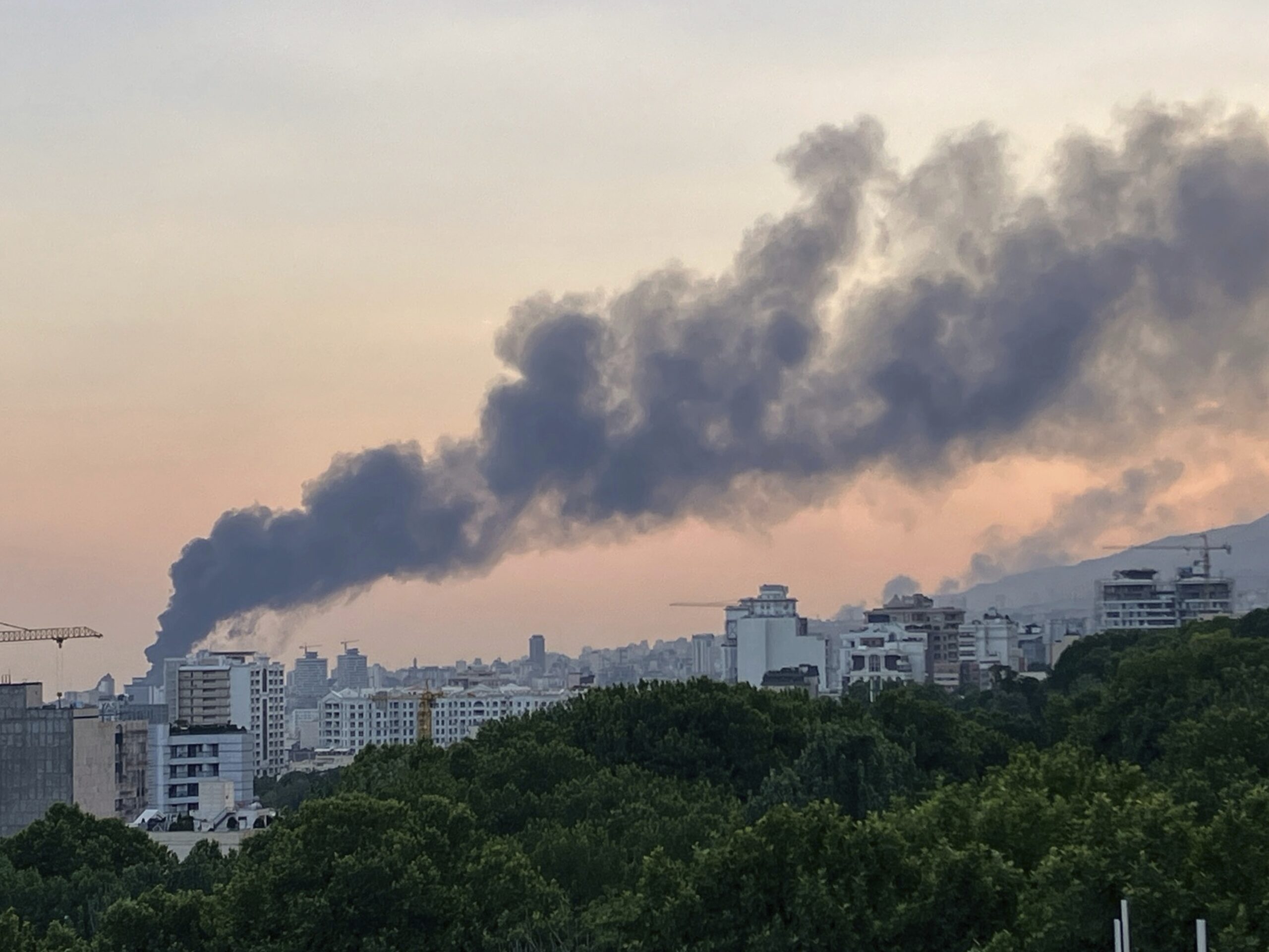 Smoke rises from the building of Iran's state-run television after an Israeli strike in Tehran, Iran, June 16. (AP Photo)