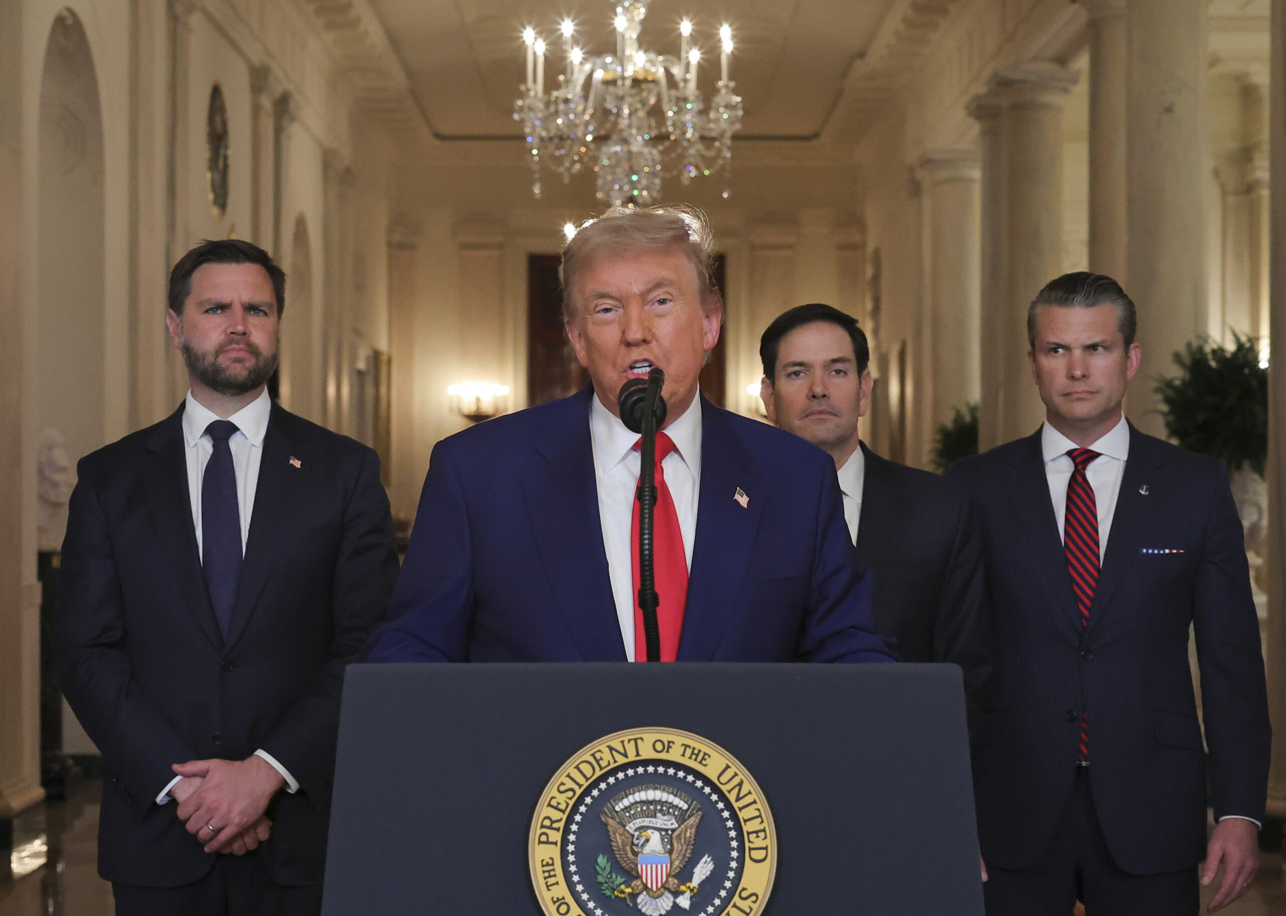 President Donald J. Trump speaks from the East Room of the White House in Washington, June 21, after the U.S. military struck three Iranian nuclear and military sites, as Vice President JD Vance, Secretary of State Marco Rubio, and Defense Secretary Pete Hegseth listen. (Carlos Barria/Pool via AP)