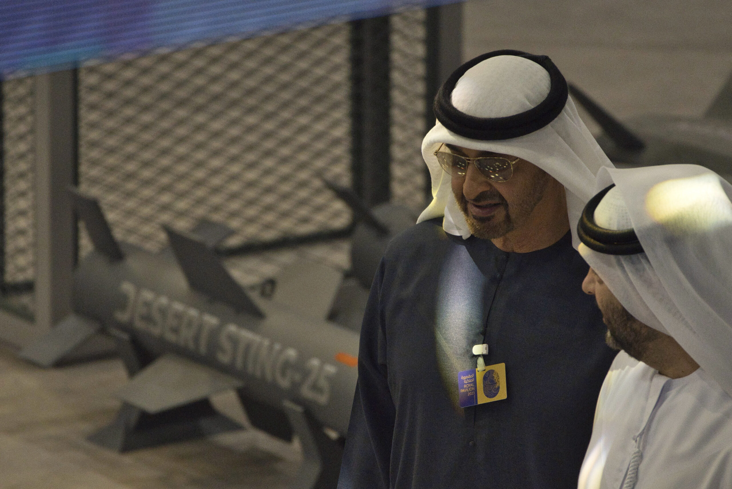 Emirati President Mohammed bin Zayed al-Nahyan, left, walks through the display of the Emirati military company EDGE while attending the Dubai Air Show in Dubai, United Arab Emirates, Nov. 15, 2023. (AP Photo/Jon Gambrell)