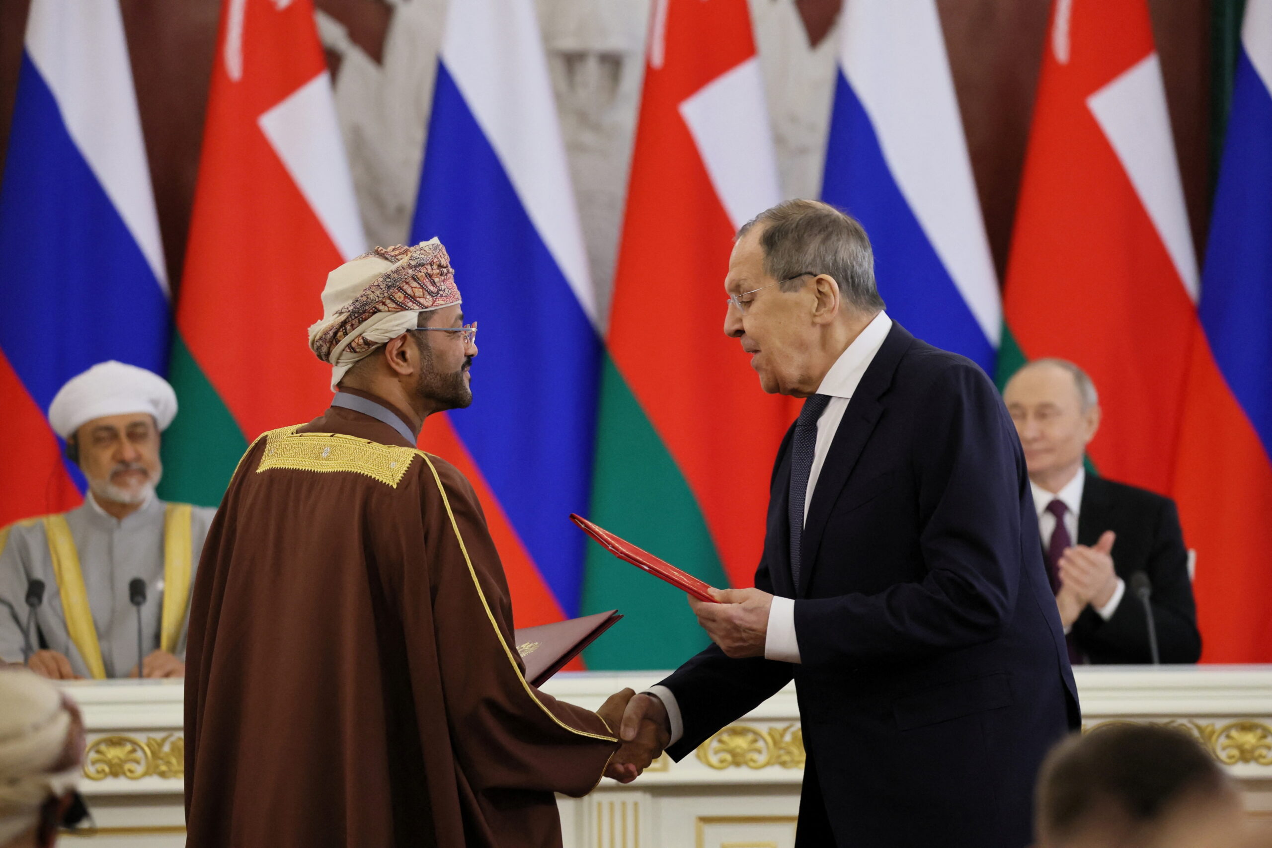 Russian Foreign Minister Sergei Lavrov shakes hands with Omani Sayyid Badr bin Hamad Al Busaidi during a signing ceremony following a meeting of Russian President Vladimir Putin and Omani Sultan Haitham bin Tariq al-Said at the Kremlin in Moscow, Russia, April 22. (Sputnik/Sergei Savostyanov/Pool via REUTERS)