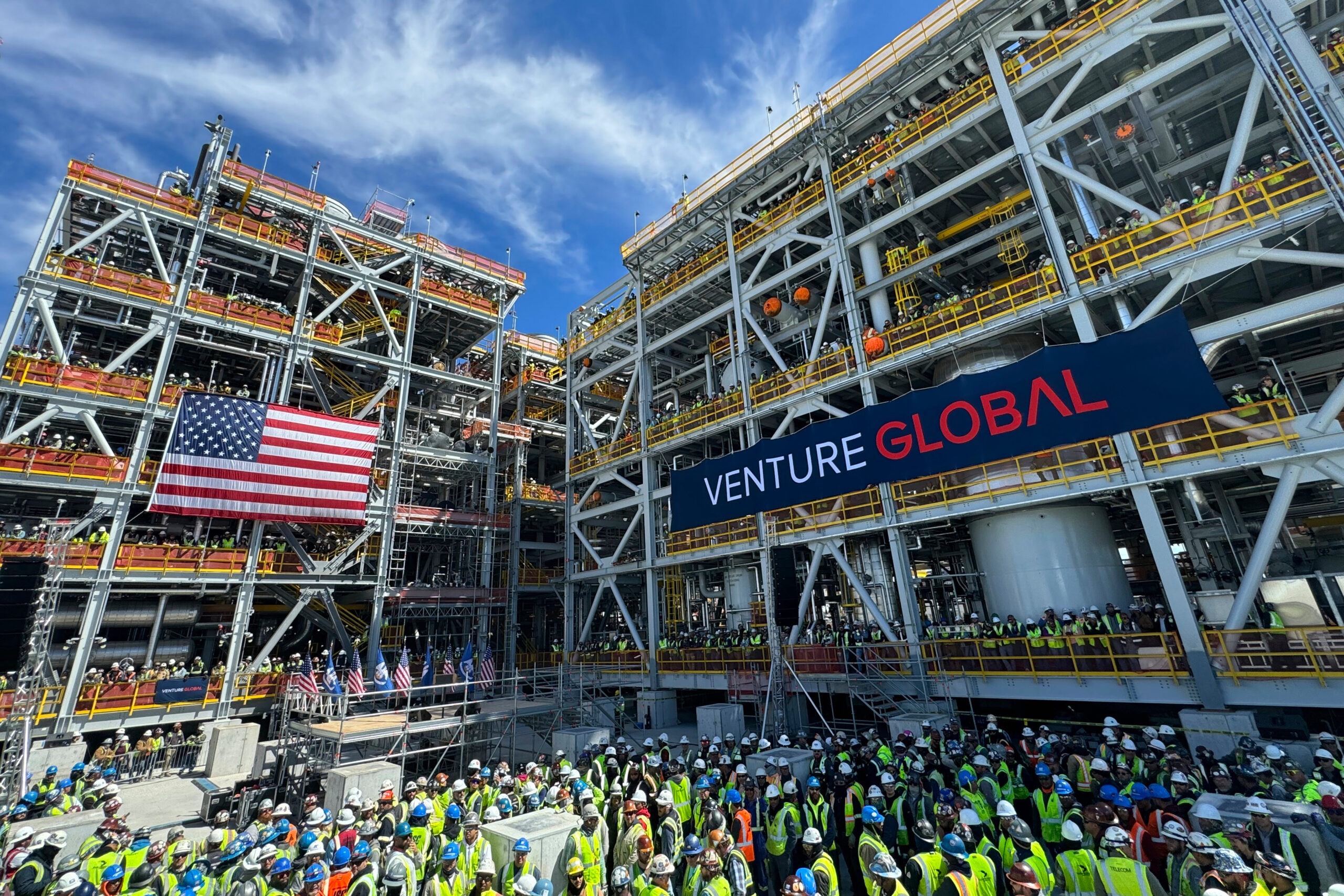 Venture Global workers await a rally with Secretary of Interior Doug Burgum and Secretary of Energy Chris Wright, March 6, in Plaquemines Parish, LA, where the company is investing billions of dollars in building out liquified natural gas export facilities. (AP Photo/Jack Brook)