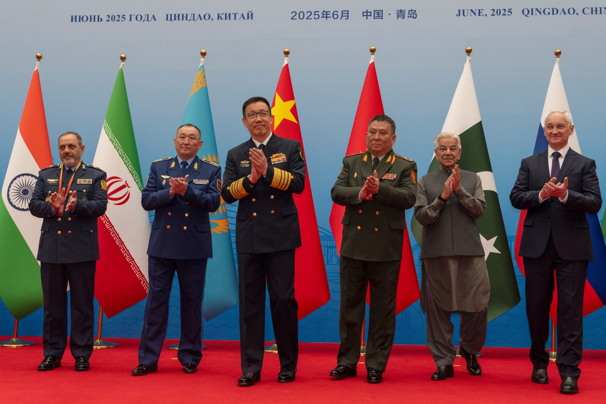 Chinese Defense Minister Dong Jun, center, with other heads of defense, including Russian Defense Minister Andrei Belousov, right, and Iranian Defense Minister Aziz Nasirzadeh, left, ahead of the Defense Ministers' Meeting of the Shanghai Cooperation Organization Members States in Qingdao, China's Shandong province, June 26. (AP Photo/Ng Han Guan)