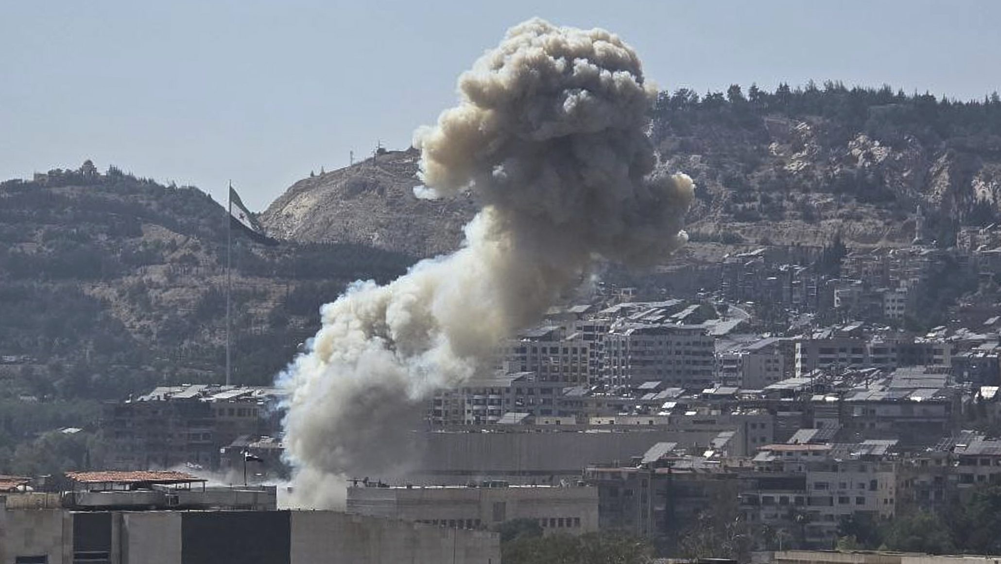 Smoke rises from an Israeli airstrike that hit the Syrian Defence Ministry in Damascus, Syria, July 16. (SANA via AP)