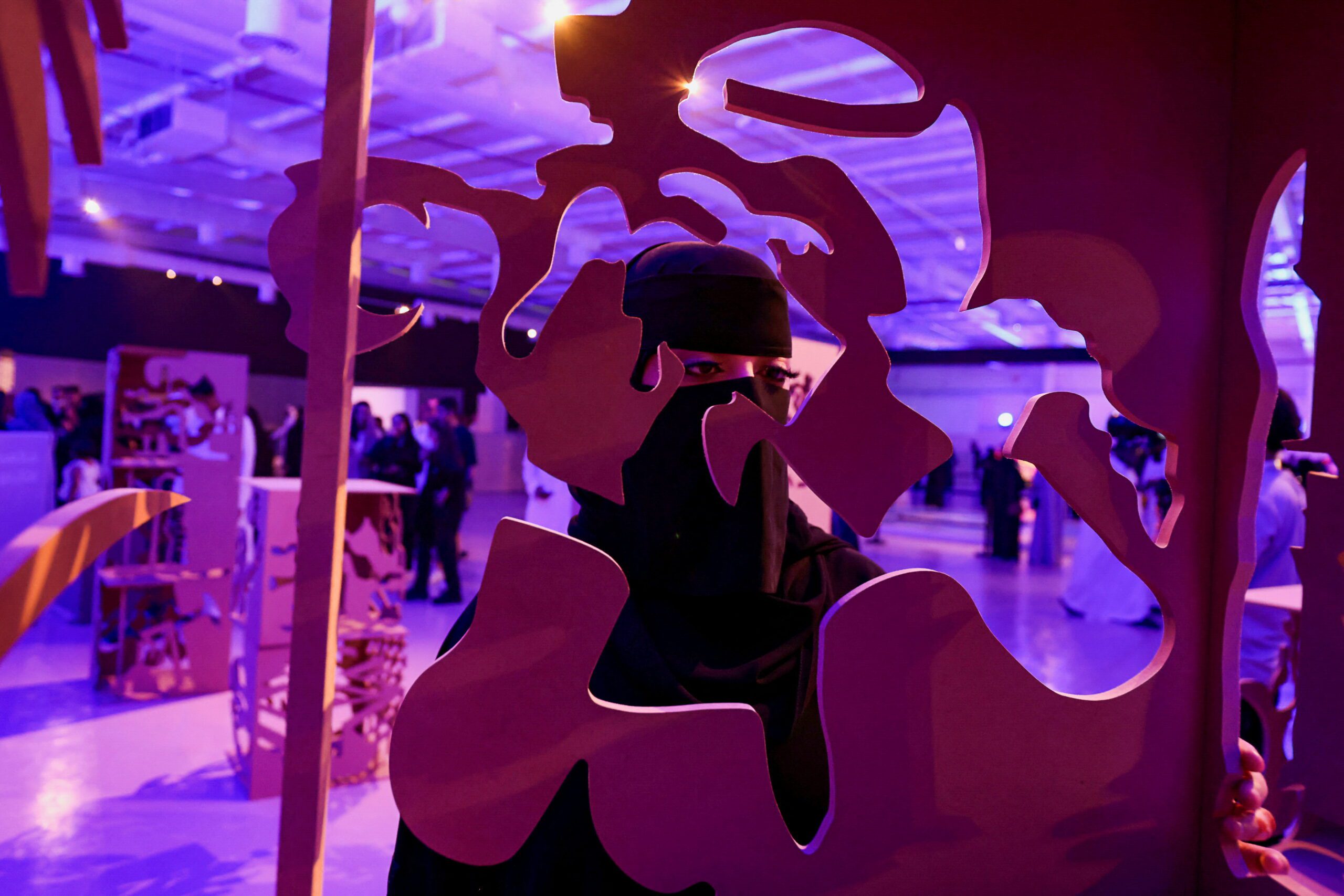 A visitor looks on through an art display at The Jax Art Festival, in Riyadh Saudi Arabia, July 20, 2022. (REUTERES/Ahmed Yosri)