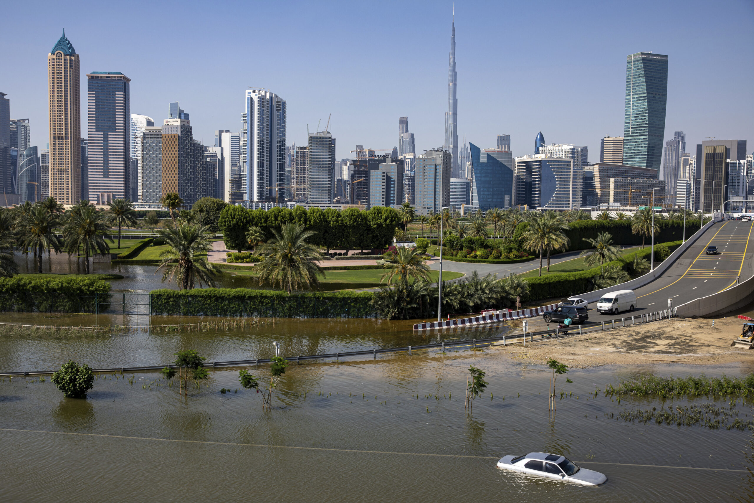 An abandoned vehicle stands in floodwater caused by heavy rain in Dubai, United Arab Emirates, April 18, 2024. (AP Photo/Christopher Pike, File)