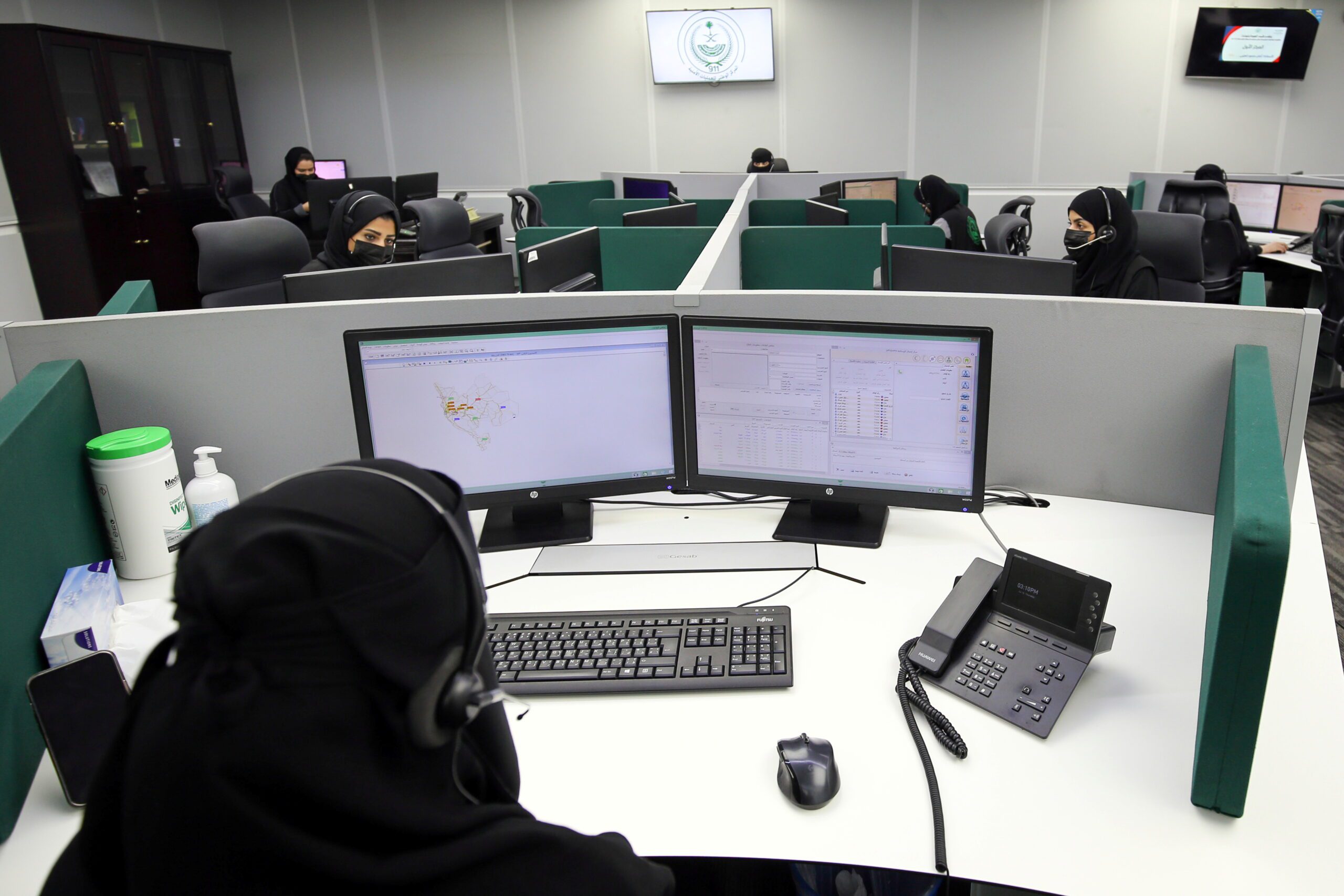 A Saudi woman works as an operator at the National Center for Security Operations for Haj, in Mecca, Saudi Arabia, July 15, 2021. (REUTERS/Ahmed Yousri)